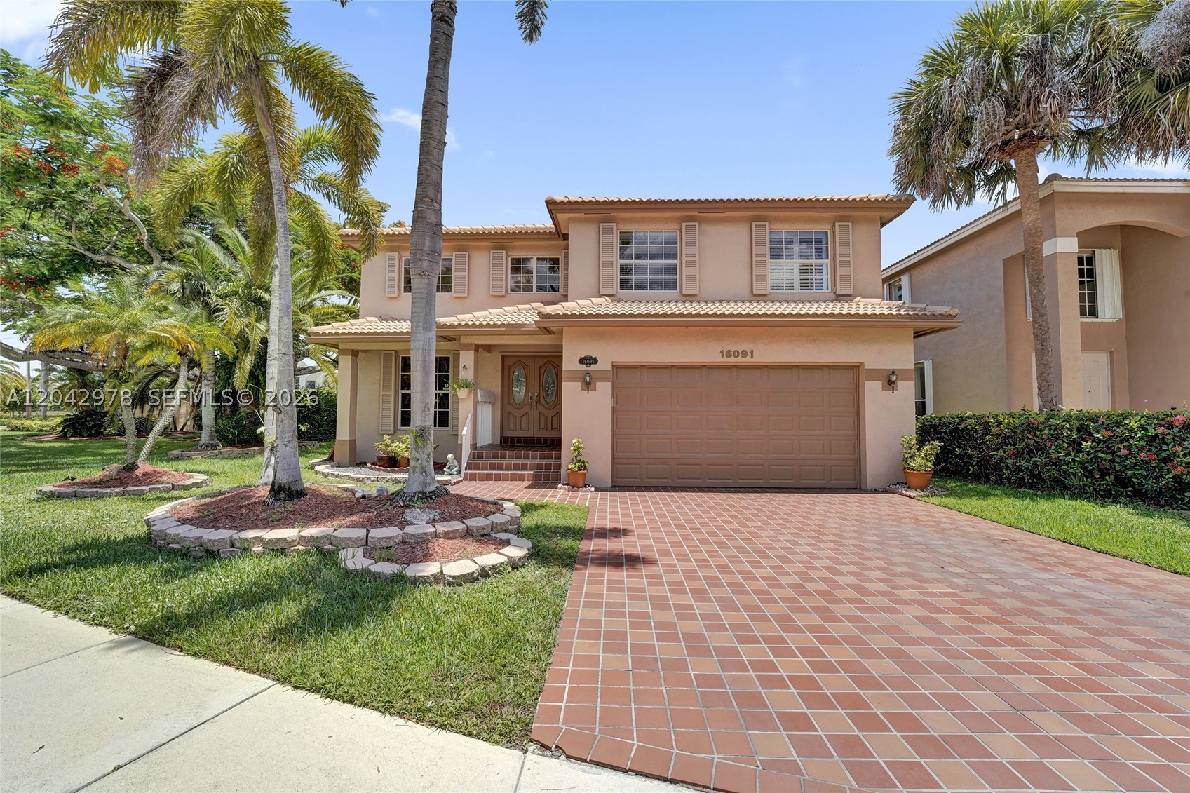 Stunning 3 bed, 2.5 bath single-family home situated on corner lot in the heart of Weston. Features volume ceilings, wood and tile floors, oversized primary suite with grand double-door entrance and 2 spacious walk-in closets. Remodeled baths, 2 car garage with epoxy flooring, accordion and Bahama shutters, screened-in back patio and more. Amenities at Bonaventure Town Center Club are amazing and include pickleball, racquetball, basketball, sauna, bowling, events, tennis courts, community pool and more.