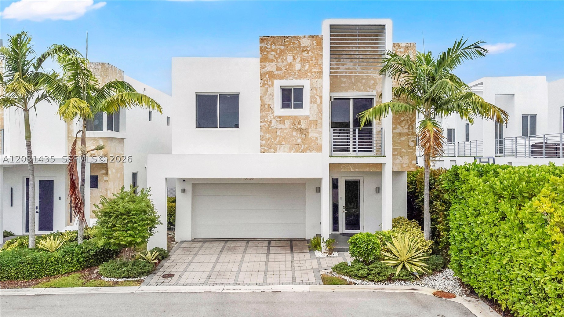 Experience contemporary luxury in the highly sought-after gated community of Neovita at Doral. This beautifully appointed residence features 5 bedrooms, 5 full bathrooms, and approximately 3,000 square feet of thoughtfully designed living space that blends elegance, comfort, and functionality. Filled with natural light, the open-concept layout is perfect for everyday living and entertaining. The heart of the home is a stunning chef-inspired kitchen with modern cabinetry, quartz countertops, premium stainless-steel appliances, and a spacious island that seamlessly connects the kitchen, dining, and living areas. A full bathroom on the first floor provides added convenience for guests. Upstairs, generously sized bedrooms offer comfort and privacy, including a luxurious primary suite designed as a private retreat. Impact windows and doors provide security, energy efficiency and abundant natural light throughout. The outdoor area offers an ideal space to relax and enjoy South Florida living year-round. Additional features include a covered 2-car garage, driveway parking for 2 additional vehicles, covered terrace and spacious backyard with room for a pool. Access to resort-style amenities, including a clubhouse, fitness center, swimming pool and beautifully maintained common areas.  Ideally located near top-rated schools, major highways, Miami International Airport, shopping, dining, and entertainment, this exceptional home offers the best of Doral living. Schedule your visit today