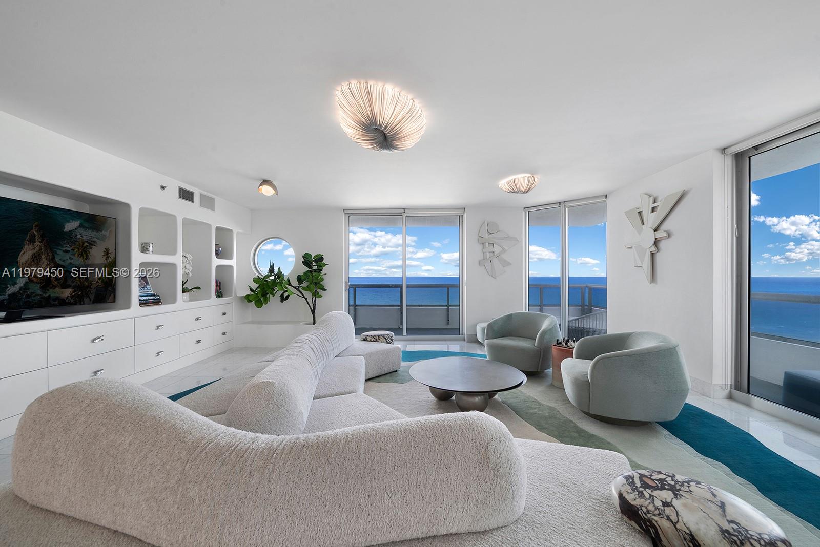 Welcome to Residence 1200 at Villa di Mare, an exclusive oceanfront boutique building of just twelve residences in Mid Miami Beach. This stunning 4,600 square foot full floor retreat boasts 5 bedrooms, 6.5 bathrooms, and panoramic views that stretch from ocean to bay to city skyline. A wraparound terrace invites endless sunrises & sunsets, while the sleek Boffi kitchen and open living spaces make entertaining effortless. The oceanfront primary suite features dual walk-in closets and dual ensuite baths with heated floors, with 4 Additional guest bedrooms. This Residence includes a poolside cabana complete with a shower as well 3 side by side parking spaces & a storage space in the garage. Conveniently positioned beside The Bath Club and La Gorce Country Club, with Bal Harbour Shops and South Beach moments away, this is Miami Beach living at its most captivating.