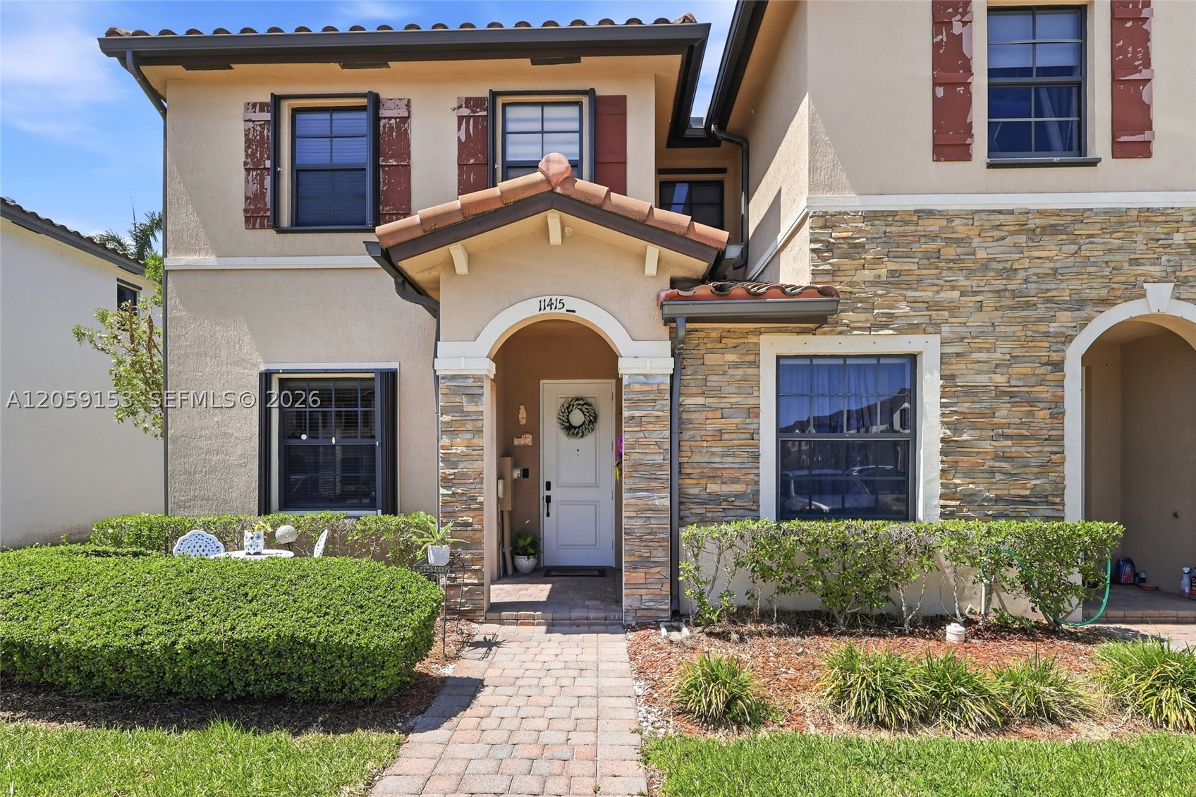 Beautiful corner townhome in the gated community of Artesa featuring 2 bedrooms and 2.5 bathrooms with a bright, modern interior. The open-concept floor plan is filled with natural light and showcases a spacious kitchen with quartz countertops, stainless steel appliances, abundant cabinetry, and a large island overlooking the living and dining areas—perfect for everyday living and entertaining. Upstairs, both generously sized bedrooms offer privacy, including a spacious primary suite with a walk-in closet and en-suite bath. Additional highlights include custom window treatments, accordion hurricane shutters, and a private fenced patio ideal for relaxing or outdoor dining. Artesa offers resort-style amenities, including a clubhouse, fitness center, sparkling pool, playground, and 24-hour gated entry. Conveniently located just minutes from the Florida Turnpike, shopping, dining, schools, and Homestead Air Reserve Base, this home offers the perfect combination of comfort, style, and convenience.