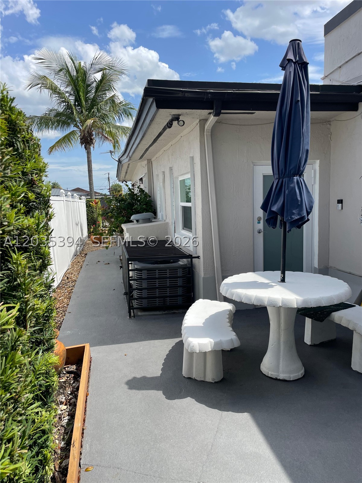 This unit in the heart of Hialeah offers privacy and a comfortable living space as well as an outdoor space with table and seating.