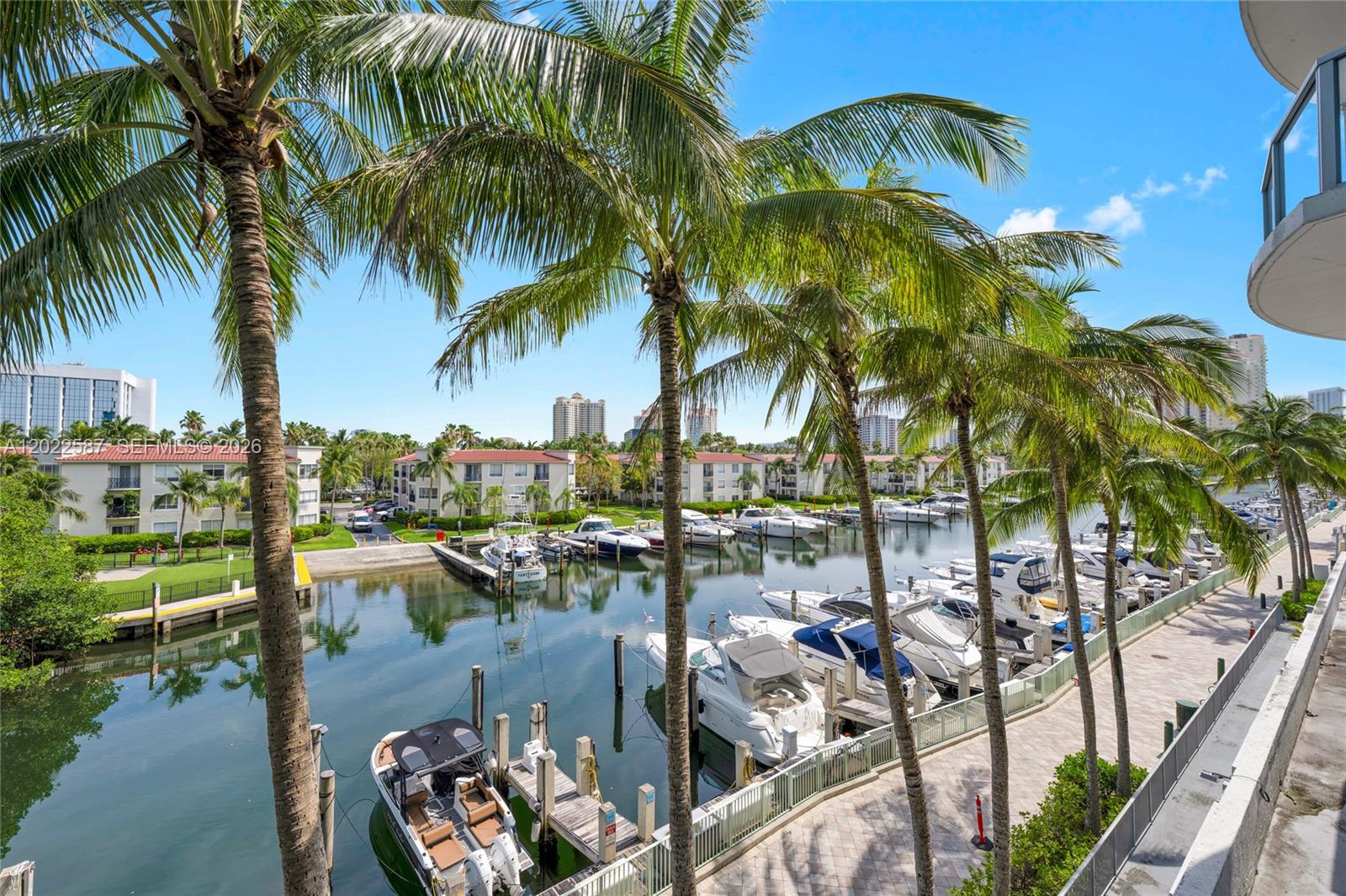 Breathtaking Intracoastal and marina views from this stunning corner lanai residence in the heart of Aventura. Spacious 3-bedroom, 3-bath loft-style residence featuring an oversized private terrace with direct private access to the tennis courts, creating a rare indoor-outdoor living experience. Bright open layout with abundant natural light, elegant porcelain floors, Italian kitchen cabinetry, stainless steel appliances, granite countertops, and in-unit washer and dryer. The spacious primary suite features a private jacuzzi, creating a true retreat within the home. Direct elevator access from the lobby, covered garage parking, and valet service. Resort-style amenities include waterfront pool overlooking the marina, tennis courts, yoga room, sauna, club room, business center, jogging path, and playground. Prime Aventura location within walking distance to Aventura Mall, dining, and A+ charter schools, and just minutes from the beach and Bal Harbour. Rentals allowed twice per year. Easy to show. Use Showing Assist.