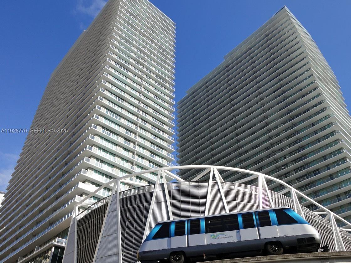 Fantastic opportunity to own in one of Brickell’s most connected buildings, Axis on Brickell. This unit offers a functional floor plan with zero wasted space, featuring neutral carpet in living areas, tile in wet areas, and a modern kitchen with granite counters and stainless steel appliances. The floor-to-ceiling glass sliding doors flood the space with natural light and open to a large balcony with urban city views. Building amenities are among the best in the area: 2 pools, gym, BBQ grills, kids' playroom, business center, and 24-hour security. The location commands high rental demand due to its proximity to the Financial District and direct access to the Metrorail/Metromover for easy access to Downtown, the Airport, and Dadeland. Unit is rented at $3550 until July 2026. Special assessment of $302 per month until May 2028 for elevator modernization.