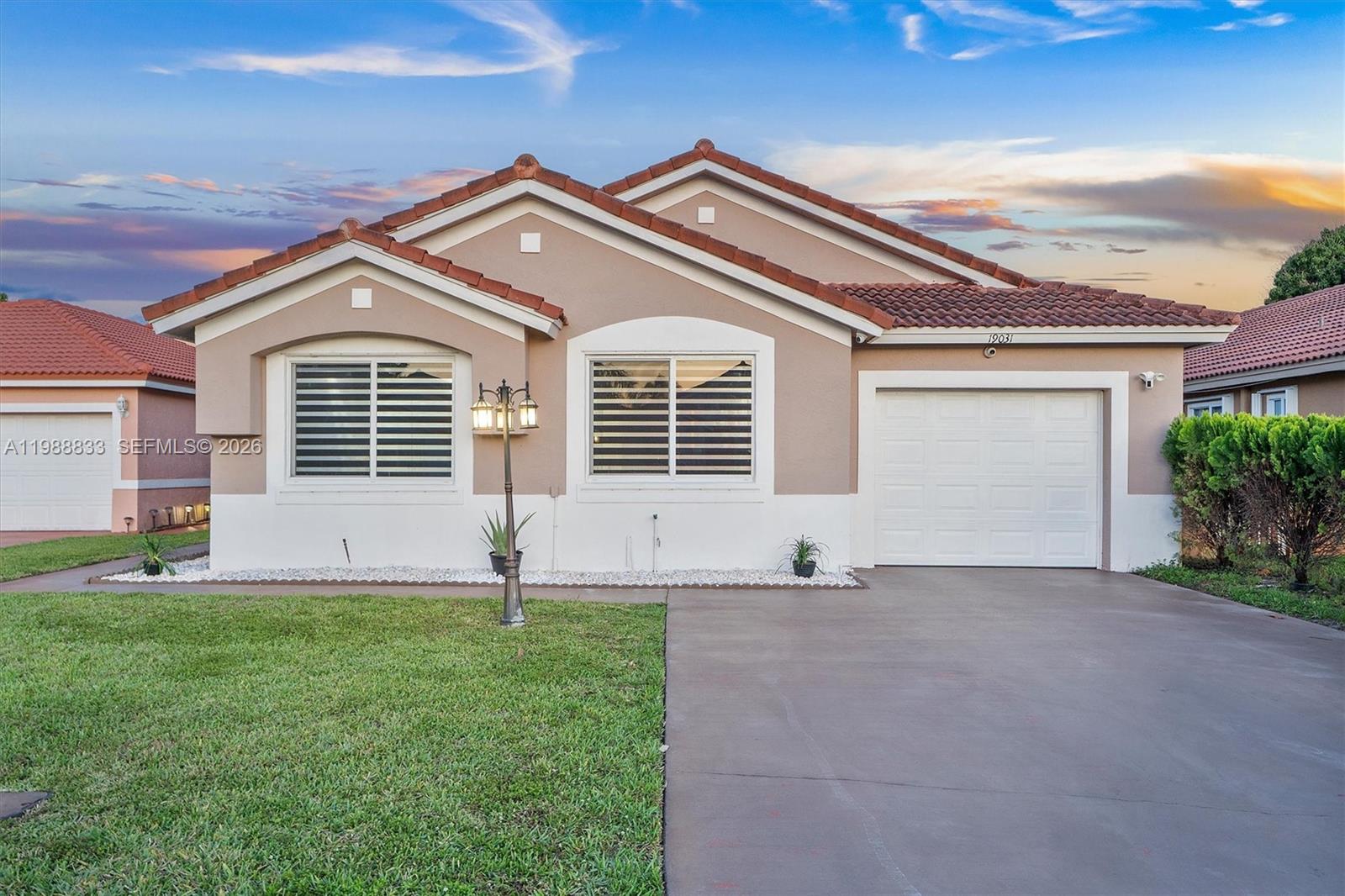 Welcome home to this beautifully updated 3-bedroom, 2-bathroom residence offering 1,692 square feet in gated Monterrey community. This home blends modern updates with a warm, inviting feel. High ceilings in the main living areas and primary suite enhance the sense of space and natural light. At the heart of the home, the fully remodeled kitchen features grey quartz countertops, ample prep space, shaker cabinetry, and stainless steel appliances. The open layout connects seamlessly to the living areas, creating an easy flow for everyday living and gathering. Multiple living spaces provide flexibility for a variety of uses, including a sunroom just off the kitchen—ideal as a home office, reading nook, or additional lounge area. Impact doors and windows offer peace of mind while filling the home with natural light. Situated on a 5,274 square-foot cul-de-sac lot, the property offers a quiet setting with a spacious backyard, a mature mango tree, and room to add a pool. Conveniently located just minutes from parks, shopping, and dining, with easy access to 826, I-95, and the Turnpike, and close proximity to Hard Rock Stadium. This home offers a comfortable, well-rounded lifestyle in a central location. Mortgage savings may be available for buyers of this listing.