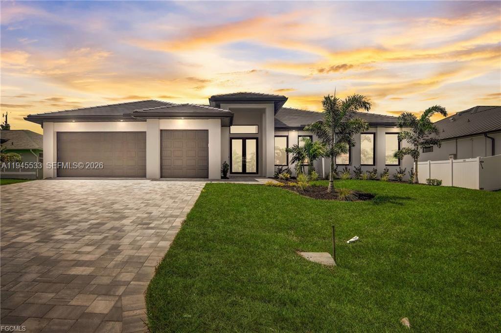 This is a Large home for the family and your guests with over 2560 air-conditioned Living space all with 4 Bedrooms, Office, 3 Full bathrooms and has 2 Primary Master suites, 3 car Garage, heated Pool & Jacuzzi, barbeque area with beverage cooler. South of Cape Coral Pkwy W. right by Cape Harbor. This Large dream home with over 2560 sq feet of Living space and over 4600 total spaces. Master Bedroom is large and has LED Tray Ceilings Double French Impact glass doors. Master Bathroom with walk-in shower large soaking tub with large back and front lit mirror Master suite guest bedroom, you have LED lited tray ceilings you have a Full Bathroom with lited mirror, walk-in closet. Bedroom has French Impact doors that go out to the pool area. Porcelain tile Floors throughout. High double tray LED lited ceilings. Living Room has Electric Fireplace. Included is a large 87-inch smart TV. Entire Resistant Windows & Impact doors lead out to the large covered screened in Lanai for indoor outdoor living with built in Barbeque with Industrial Vent that is vented out when cooking also has Wine and Beverage cooler + sink. Stainless-Steel Appliances, Gigantic Quartz Counter Island waterfall, Under Large Quartz counter is so much hidden storage. Along with soft closing cabinets. Nice size Pantry. Wine rack & Beverage cooler. Tile Roof. Driveway is Large with brick pavers. Laundry Room with cabinets, sink and Quartz countertop as well.