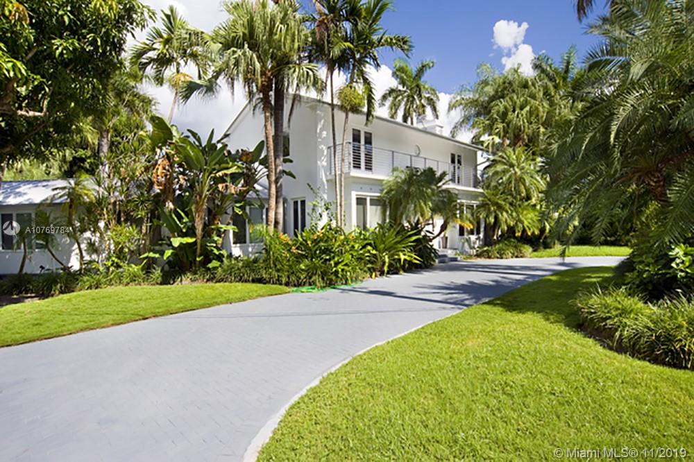 CORNER LOT,  ESTATE SIZED Tropical Oasis with 25,500 Sq feet of waterfront land provides ample development opportunity to either add Sq footage, or demolish and build your dream home of potentially 13,000 square feet!!! Classic  pre-MiMo home with 4 bed and 5.5 bath is located in Guard Gated Sunset Island 4. Considered the most walkable area in Miami Beach and within minutes to Lincoln Road and Sunset Harbor, this neighborhood supplies every retail need.  Mature landscaping ensures privacy and 80 ft of water frontage has room for your boat with a 13,000 pound boat lift. Massive corner lot affords potential double sided entrance, one formal entrance and one for staff, while still maintaining a spectacular large rear yard to relax and entertain. Call today to stroll around the property.