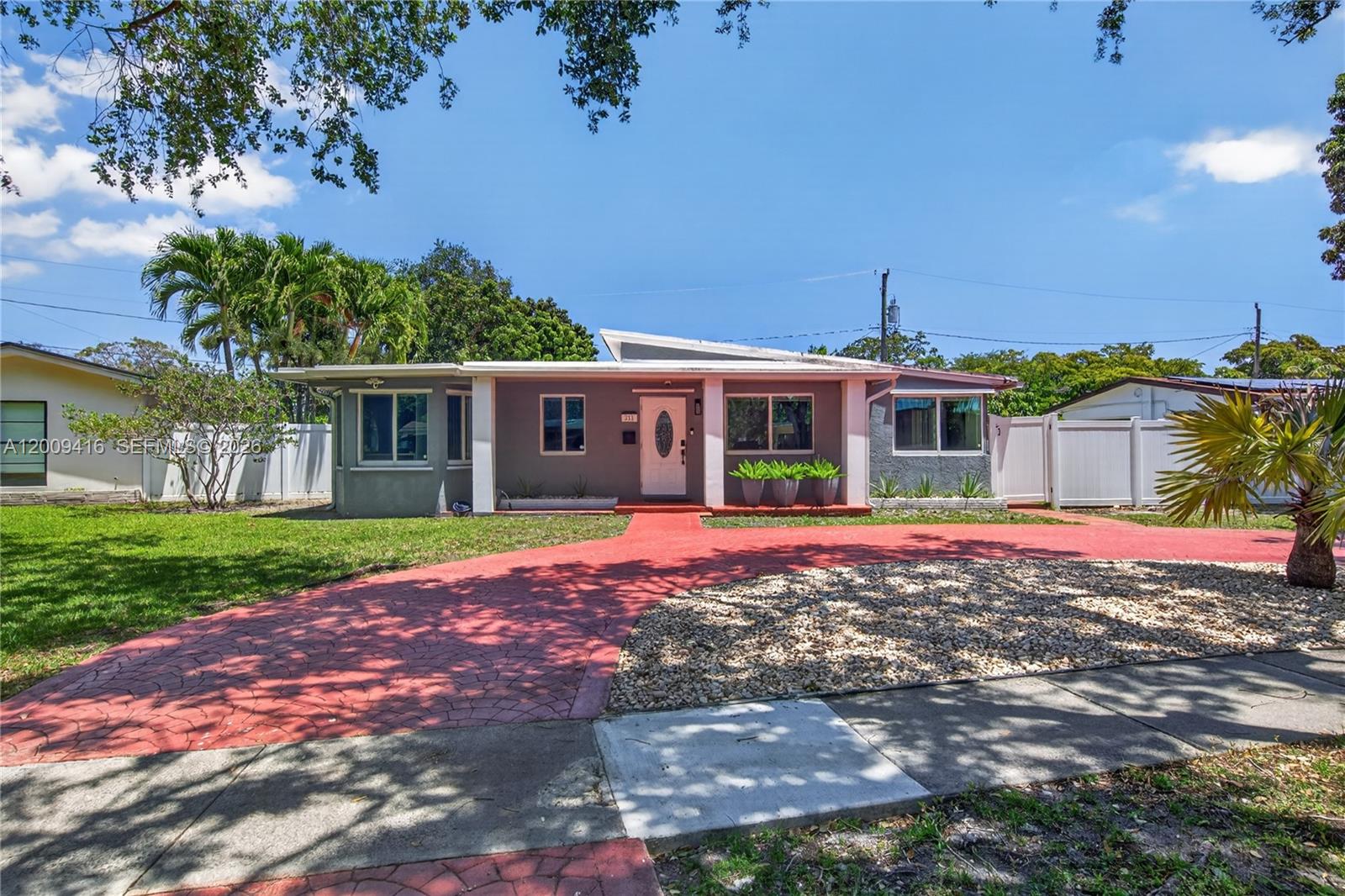 Welcome to your dream home in the highly sought-after Lawn Acres subdivision of Hollywood! This stunning 3-bedroom, 3-bathroom pool home has been meticulously renovated, upgraded, and designed. There are two primary bedrooms with private en-suites on opposite sides of the home for complete privacy. The interior features a beautifully updated kitchen and bathrooms, highlighted by New Samsung Kitchen Appliances (2023) and a New Samsung Washer and Dryer (2023). Major structural and system improvements include a New TPE Flat Roof (2024), a new water heater (2023), and the replacement of all cast-iron plumbing with modern PVC (2024). This home is built for protection and efficiency, with hurricane-impact windows on all exterior doors. Outside, enjoy a massive, beautifully landscaped backyard on a spacious lot, with mango and gardenia trees and a New Vinyl Fence (2026) for ultimate privacy. The property also boasts two screened-in patio areas, a paved driveway, an outdoor shed, and Ring security cameras for added convenience. With no HOA and a prime location just minutes from the Hard Rock Casino, major highways (I-95 and Turnpike), and the beach, this is an incredible opportunity for both homeowners and investors alike.