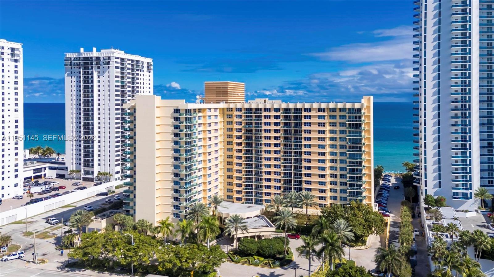 Enjoy resort-style living in this spacious 1-bedroom, 1.5-bath residence at The Wave, an award-winning oceanfront community on Hollywood Beach. Situated on the ninth floor, the unit offers breathtaking ocean and canal views from both the balcony and bedroom. The building was renovated in 2005, with recently updated common areas maintained to high standards. Ideal for both personal use and investment, rentals are permitted with a minimum three-month lease. The unit features a large kitchen, two convenient Murphy beds for guests, and a flexible layout that’s move-in ready. Experience beachfront living with exceptional amenities and income potential.