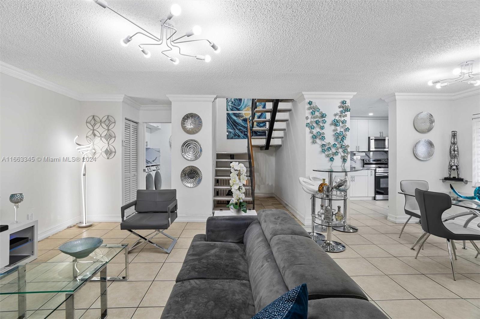 A beautifully remodeled and updated townhouse located at 10425 SW 153 Ct, Unit 4. This property features two master bedrooms and two and a half bathrooms. The home has been upgraded with impact-resistant doors and windows, as well as a brand-new kitchen and bathrooms. It also includes a new washer and dryer. Situated in the well-located Palm Point community within The Hammocks, this townhouse offers convenience and comfort in a prime location. OPEN HOUSE SATURDAY 11 AM - 3 PM