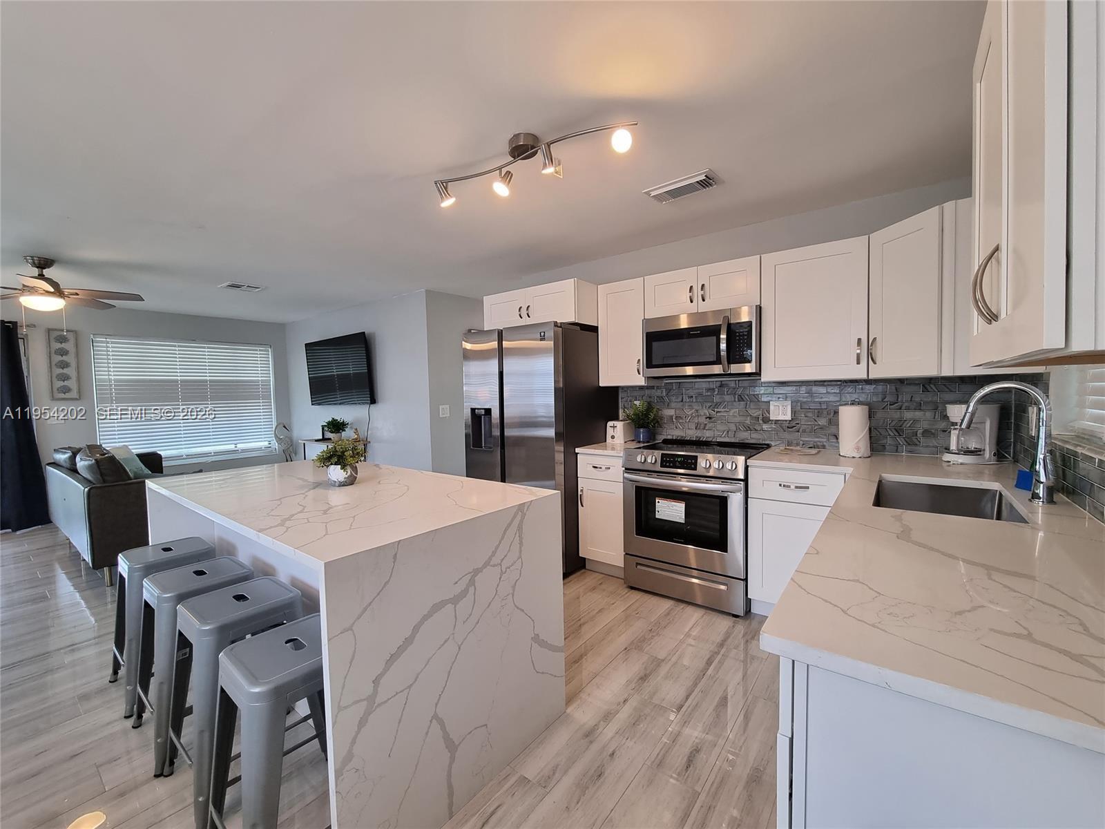 Seller Motivated , Huge Price Drop! Live the true South Florida boating lifestyle in this fully renovated 3-bedroom, 2-bath waterfront gem perfectly positioned on the Dania Cut-Off Canal, one of the quickest ocean-access boating routes from residential canals to the Fort Lauderdale Inlet. Enjoy direct, no-wake access to the Atlantic Ocean. Whether it’s a weekend run to the Bahamas, deep-sea fishing, or world-class diving, this home puts South Florida’s ultimate boating lifestyle right at your dock This move-in-ready home features an open-concept layout, a designer kitchen with waterfall countertops, and high-end fixtures and finishes throughout. Unlike many nearby waterfront homes, this property offers exceptional value without the Fort Lauderdale price tag, making it one of the most affordable ocean-access opportunities in the area. Ideally located minutes from FLL Airport, Hard Rock Casino, and major highways (I-95, Turnpike, 441, I-595), and close to local houses of worship. Turnkey, renovated, and priced to sell — this is waterfront living done right. Call for more info.
