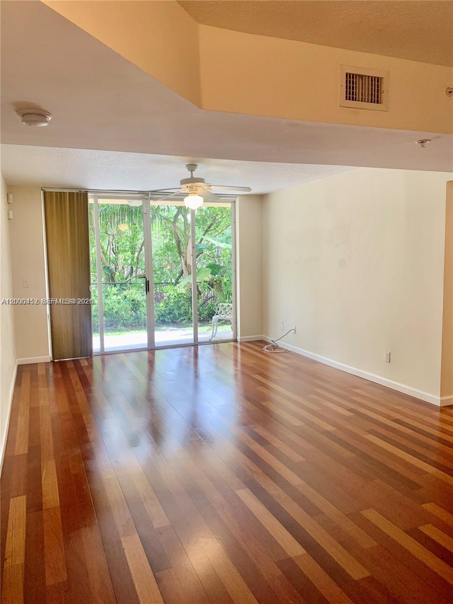Beautifully remodeled 2 bed / 2 bath corner unit with a lot of privacy and peaceful views of the conservation area in the back.

Bright, open layout with a spacious living and dining area that flows out to your patio, with easy access to the garden.

You’re surrounded by nature here, but still just minutes to the beach, shopping, and restaurants.

The kitchen features wood cabinets and granite countertops, and opens right into the main living space. Both bedrooms are a great size, with plenty of storage throughout. Wood floors run through the entire unit.

Washer and dryer in the unit for added convinience.