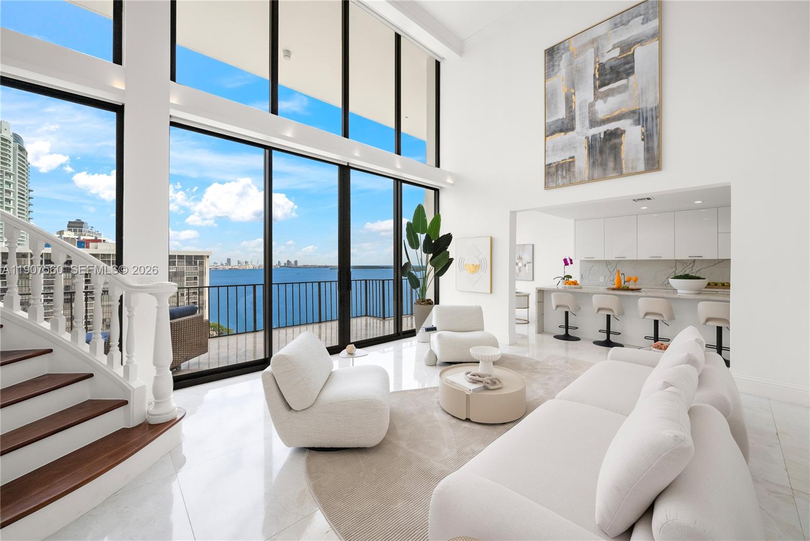 Penthouse Perfection! Experience breathtaking panoramic water & skyline views from this renovated 2-story residence in the heart of Brickell. Facing northeast, it captures dramatic sunrises over Biscayne Bay & the Atlantic Ocean, visible from every room. Boasting 5,430 SF of sophisticated interiors, grand living & entertaining spaces, new floor-to-ceiling impact windows, seamless indoor/outdoor living, & an oversized terrace spanning the full length of the unit. The expansive primary suite offers a private balcony, 2 walk-in closets, & a gorgeous bathroom with dual vanities, shower & soaking tub. Nestled directly on the water in a quiet guard-gated community with a pool, gym, tennis/squash/racquetball courts, boat docks, playgrounds, salon & 24-hr security. 4 assigned parking spaces. BOAT SLIPS AVAILABLE FOR SALE & RENT!