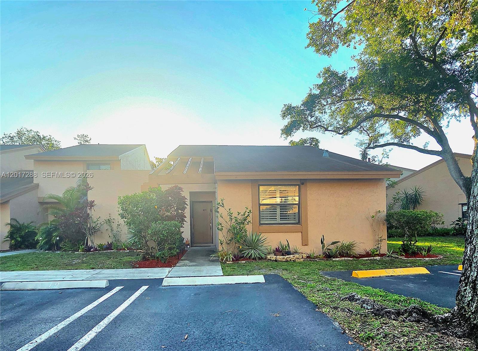 Upgraded 2-bedroom, 2-bath corner villa featuring enhanced privacy and natural light. This move-in-ready home includes a modern kitchen, updated bathrooms, tile flooring, and an open layout. The corner unit offers extra outdoor space, spacious bedrooms, and a relaxing patio. Conveniently located near shopping, dining, and highways, it perfectly combines comfort and style.  Rock Creek master fees are $200.00 quarterly including all the amenities.