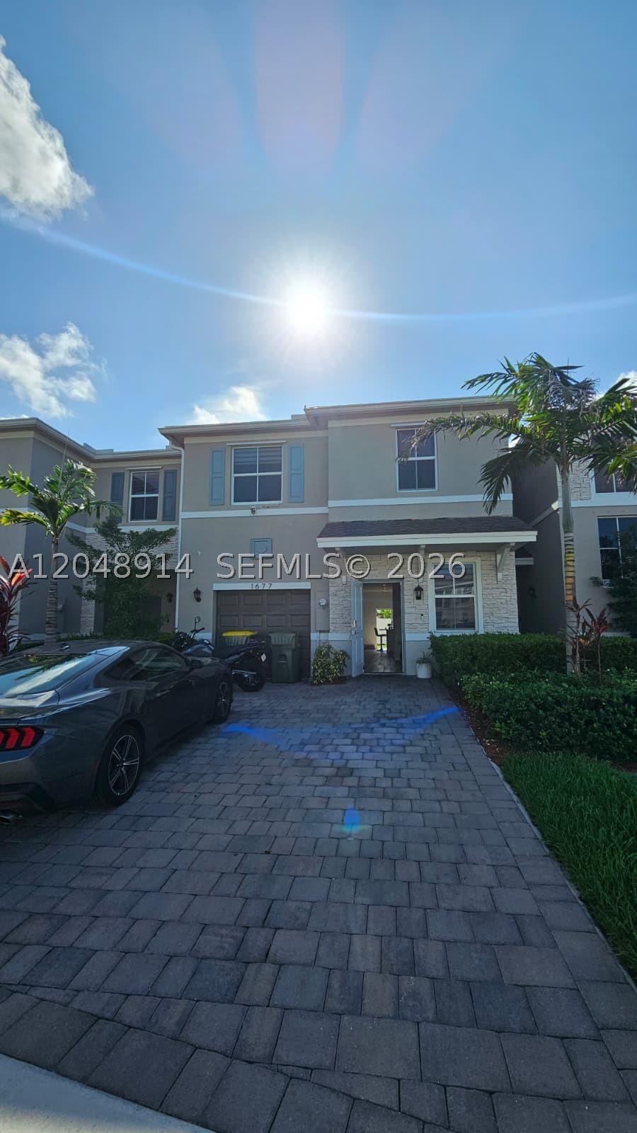 Step into nearly-new luxury with this stunning 4-bedroom, 2.5-bath townhouse with a 1-car garage, built in 2022 by D.R. Horton and still under builder warranties! Furniture negotiable. Located in a beautifully maintained Homestead community, this smart home offers comfort, style, and security. All four spacious bedrooms are upstairs, including a large primary suite with a private bath and oversized closet. Plush carpet upstairs and ceramic tile flooring downstairs create a warm, modern feel. The open-concept kitchen features marble countertops, perfect for entertaining. Enjoy a fenced backyard with rear gate access to additional guest parking. Parking includes a 1-car garage plus space for 3 more vehicles. Smart features include Ring doorbell, front and rear security cameras, and a central panel to control the A/C, lights, alarm, and cameras. Hurricane panels are included. Conveniently located near Publix, Walmart, Walgreens, Presidente, schools, Homestead Hospital, shopping, restaurants, parks, the Florida Keys Outlet Marketplace, and major highways including the Turnpike and US-1.