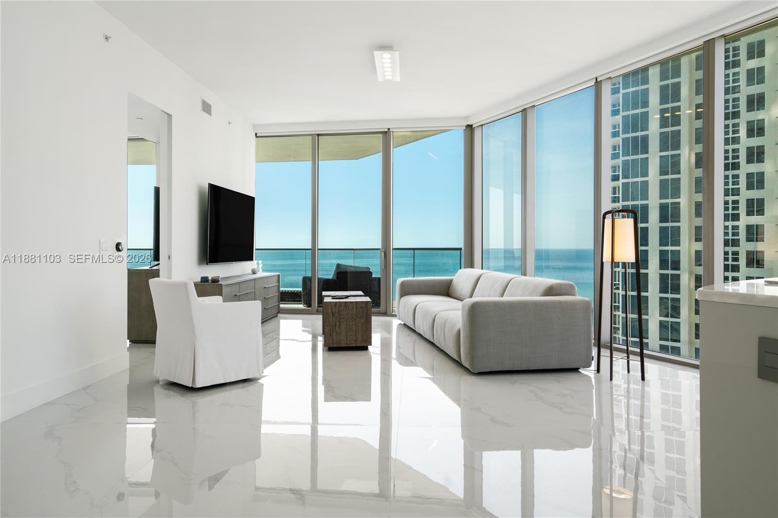 Experience the Armani lifestyle in this oceanfront gem at Sunny Isles Beach. This elegant 2 bedroom + den, 2.5 bathrooms residence showcases 10-foot ceilings and floor-to-ceiling windows framing breathtaking ocean and city views. An oversized balcony with a summer kitchen extends your living space outdoors. Inside, Armani’s signature touch is reflected in the custom finishes and top-tier appliances. Residents enjoy an unmatched collection of amenities, including private oceanfront dining, the tranquil Armani Spa, a state-of-the-art fitness center with direct beach access, movie theater, cigar lounge, children’s playroom, and more.