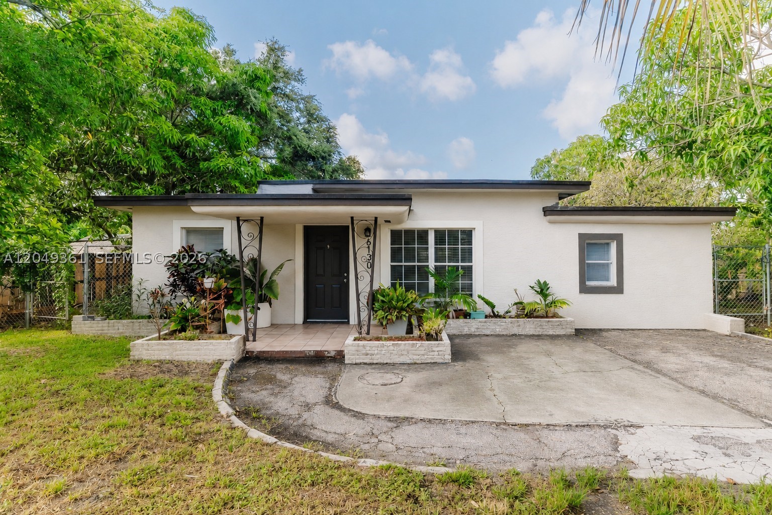 Welcome to this charming and spacious 3-bedroom, 2-bath single-family home situated on an oversized lot with plenty of outdoor space to enjoy. The home features a bright, open layout, an updated kitchen with stainless steel appliances, renovated bathrooms, tile flooring throughout, and a separate laundry room for added convenience. Relax or entertain under the covered rear patio while enjoying the privacy of the large backyard. The expansive front yard and long driveway provide ample parking for multiple vehicles. Ideally located in a quiet residential neighborhood just minutes from SR-7 (441), Florida’s Turnpike, and I-95, with easy access to shopping centers, supermarkets, restaurants, schools, parks, and everyday conveniences. A wonderful place to call home. Schedule your private showing today!