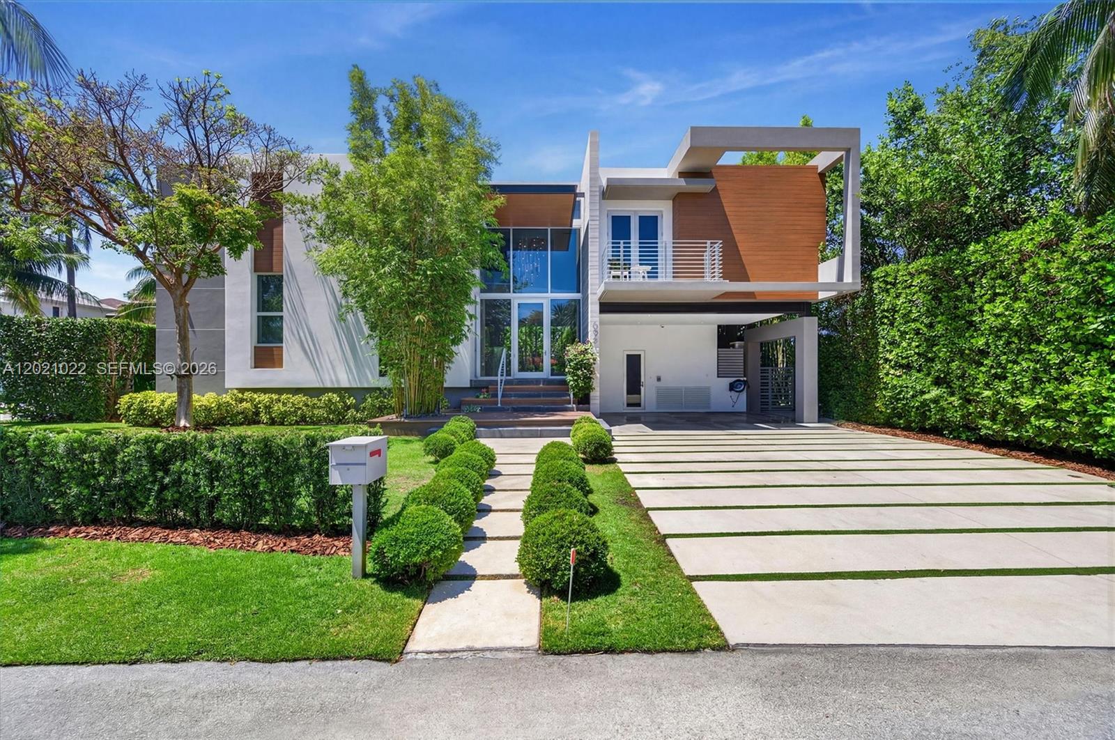 A modern Key Biscayne home elevated by $1M+ in owner upgrades. This 5BD/5.5BA, two-story residence spans 4,416 SF and lives like new—built in 2017 and thoughtfully enhanced throughout. The first floor flows around stunning pool views, anchored by an open living, dining, and Miele kitchen. Clean lines and warm woods balance bold with inviting. A dedicated gym, office, laundry, and media room with projector & hidden screen complete the interior. Smart-home tech controls sound (hidden speakers and projector), lights, and alarm. Full-perimeter camera system and rooftop solar with battery backup add security and efficiency. Move-in ready contemporary living at its finest on the island on a quiet pedestrian-free street.