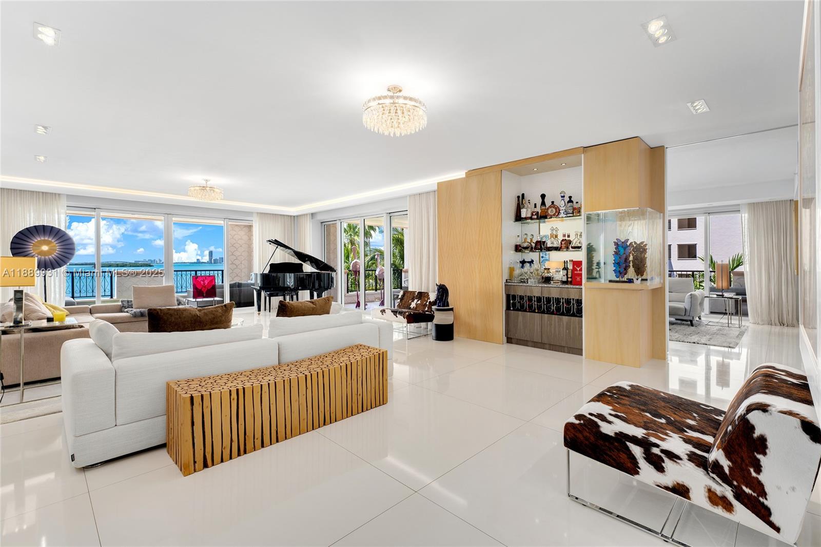 This stunning 4BR/4.5BA Bayview unit spans 4,109 SF w/chic modern décor. Three terraces offer exceptional indoor-outdoor living, including 2 main bayside terraces with sunset views over Virginia Key, Biscayne Bay, & Miami skyline. Exquisite porcelain floors grace the common areas, light English oak flow in the bedrooms. An open living room features a custom bar, designer lighting & book-matched onyx wall inset. Elegant family & dining rooms offer terrace access. Gourmet kitchen sports Viking & Sub-Zero appliances plus Pendini cabinetry. The bayside principal suite boasts a custom closet room & spa-inspired bathroom w/Calacatta Gold marble, walk-in shower, dual vanities & water closets. 3 additional bedrooms include walk-in closets & en-suite baths. Unit embodies waterfront luxury & style.