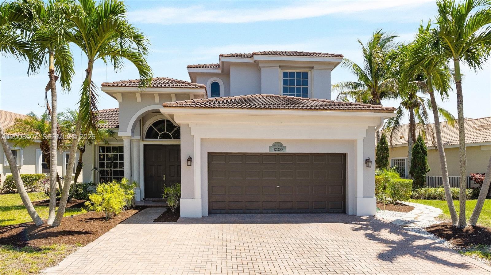 Sensational 4BR/3BA home in the highly sought-after, gated community of Heron Bay, offering one of the best long lake views in Heron Bay. This beautifully updated residence features a brand-new kitchen with quartz countertops, island, soft-close cabinetry, and stainless steel appliances. Interior highlights include marble & wood floors, crown molding throughout, and a spacious primary suite with private balcony with serene water views, custom closets, and a luxurious spa-like bath. Enjoy South Florida living in a fenced backyard with lush tropical landscaping and a heated saltwater pool overlooking serene water views. Heron Bay offers resort-style amenities including clubhouse, fitness center, tennis & basketball courts, sauna, water park/play area, and resort-style pool. Located in an A-rated school district. HOA includes lawn care and amenities.