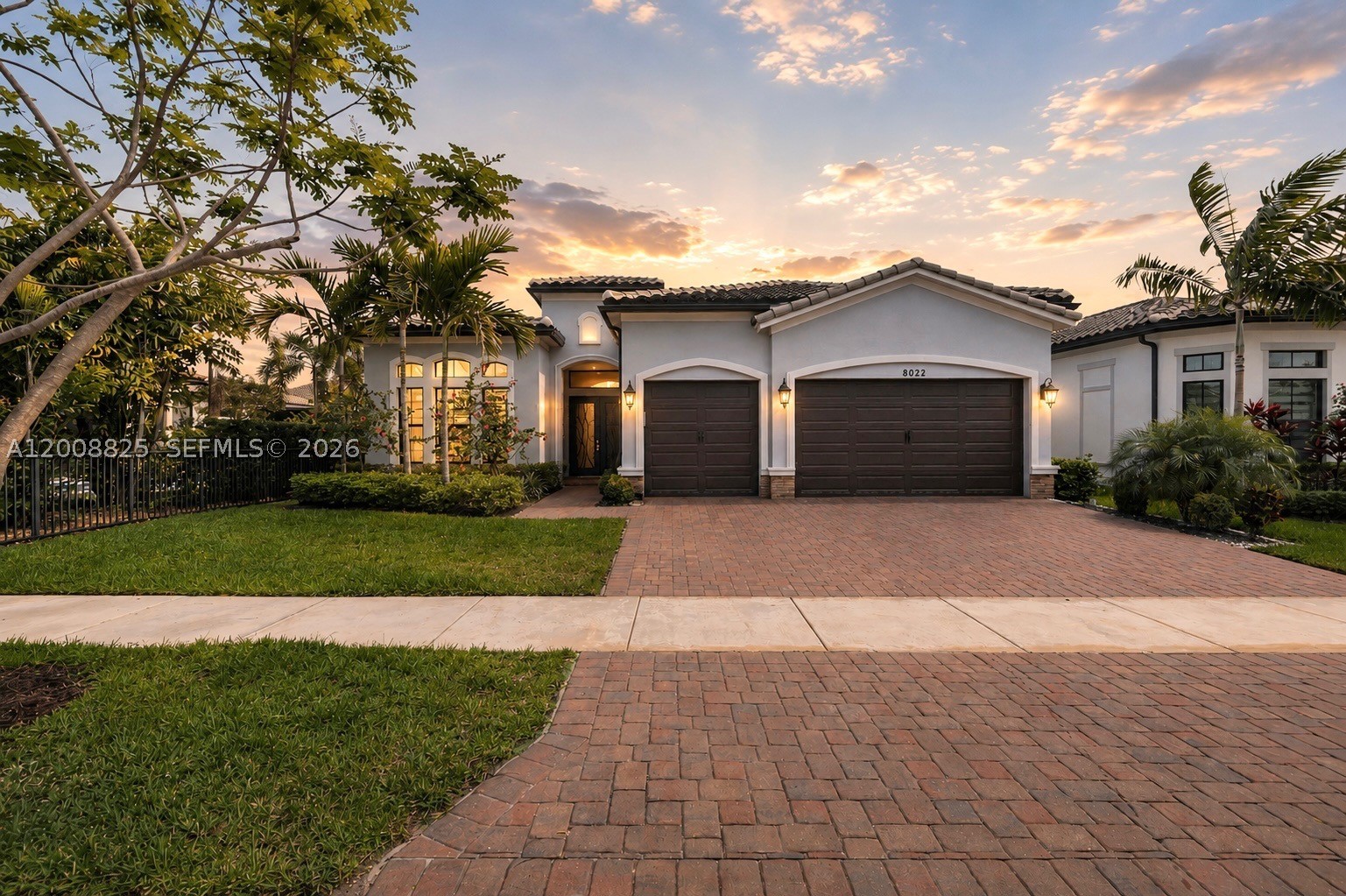 Meticulously upgraded 3BR/3.5BA home offering 2,613 sq ft of refined living with high-end finishes throughout. Features include custom closets in all bedrooms and spa-like baths with floor-to-ceiling tiled showers. The chef’s kitchen showcases a 10’x6’ quartz island with built-in storage, double wall ovens, and a fully customized walk-in pantry.

The living area is enhanced by a porcelain media wall, floating media center, and premium Sonos surround sound. Motorized Hunter Douglas shades in the main living areas provide effortless light control and showcase serene pool and lake views. The primary suite offers a luxurious custom walk-in closet and direct access to the backyard.

Step outside to a true resort-style oasis featuring a fully equipped outdoor kitchen with pizza oven, gas grill, smoker/charcoal grill, griddle, burners, built-in refrigerator, ice drawer, sink, and large granite island. Enjoy a heated saltwater pool and spa with sun shelf, waterfalls, and a gas fire pit overlooking the lake. Motorized floor-to-ceiling screens allow for a fully enclosed or open-air experience.

Additional highlights include a 3-car garage with epoxy flooring and custom cabinetry. A rare blend of luxury living and exceptional indoor-outdoor entertaining.