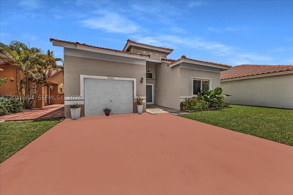 Spacious two-story single-family home in the gated Monterrey community of Miami Gardens offering 4 bedrooms, 2.5 baths, approximately 2,054 sq. ft. of living area, and a 1-car garage. This well-designed layout features bright open living areas, tile flooring throughout the main level, an updated kitchen with quartz countertops, stainless-steel appliances, and modern cabinetry. The ground-floor primary suite adds convenience and privacy, while the second floor offers three additional bedrooms and a full bath. Major upgrade: impact windows and doors throughout, providing storm protection and added peace of mind. Enjoy a fenced backyard with screened patio and concrete slab, ideal for outdoor dining, entertaining, or relaxing. Monterrey offers gated entry, patrol, community pool, basketball courts, playground, and low HOA fees. Conveniently located near the Florida Turnpike, Palmetto Expressway, shopping, dining, and major commuter routes. A strong opportunity for buyers seeking space, upgrades, and community amenities in Miami Gardens. Buyer to verify all property details, HOA, flood zone, schools, measurements, and restrictions