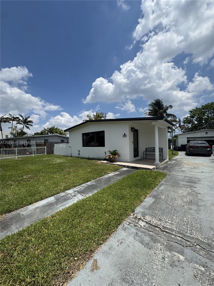 This charming single family home is located in the prestigious & highly desirable Westwood lakes subdivision. The home boasts an open floor plan with exceptional interior lighting, fresh paint and flat finished drywall for a modern look and feel. This 2bedroom,1 bathroom has countless upgrades such as porcelain tile floors, cherry wooden cabinetry, granite counter tops, stainless steel appliances, laundry room, Impact windows and doors. Exterior home features LED soffit lighting throughout with a detached 2 car garage / workshop with a separate electrical panel which was fully permitted in 1985 with plenty of storage space for your cars and or hobbies. The exterior patio features fully motorized iron gate fence with private driveway entrance and a dead end street for added privacy.