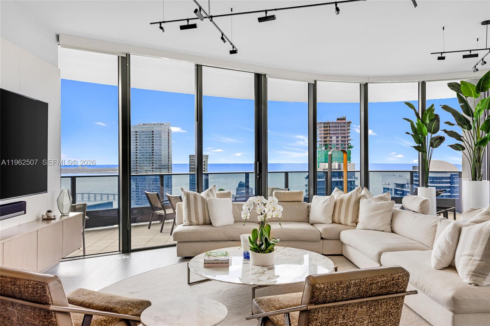 Experience Ultimate Privacy and Exclusivity in this Stunning 60th-floor Penthouse at Brickell Flatiron. This much sought after "02" line features 3 Bedroom 3.5 Bathroom Residence boasting 2406 sqft per developer. This Abode Offers breathtaking panoramic 180 degree views of Biscayne Bay, Miami Beach, Key Biscayne, Brickell skyline, and Miami. This Residence is designed for elevated living and Thoughtfully upgraded with Italian Finishes, custom closets and cabinetry, designer lighting, window treatments, wine storage, and more. Floor-to-ceiling 10-foot glass windows flood the home with natural light, complimented by sleek Snaidero kitchen cabinetry and premium Miele appliances. Features include Oversized Storage Closets, Separate Laundry Room and a full-length wrap around balcony accessible from every room.
Residents enjoy access to the exclusive 64th-floor Sky Club, featuring a resort-style pool, expansive fitness center with Pilates and yoga studio, and a private spa and relaxation area. Additional amenities include a club room, lap pool, theater, lounge, and more. Full-service building with 24-hour valet, concierge, doorman, and security. Ideally located steps from Mary Brickell Village and Brickell City Centre, World Class Restaurants and Shops.