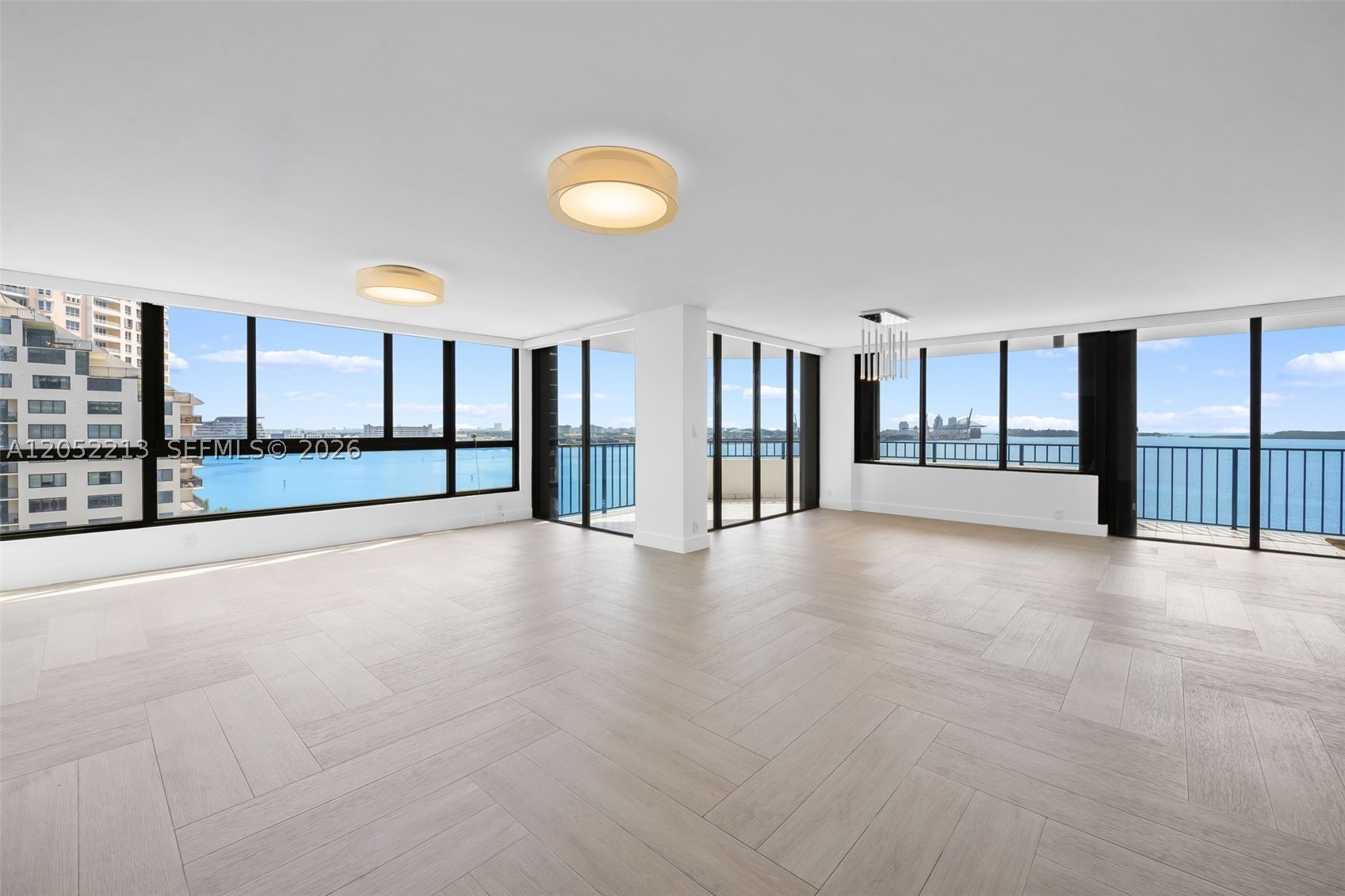 Island Living, Elevated. An exquisite and truly unique waterfront retreat where island tranquility meets refined sophistication. This fully remodeled 4-bedroom condo delivers a resort-caliber lifestyle, with sweeping water views that set the tone the moment you walk in.  The open-concept living and dining space is bathed in natural light, framed by floor-to-ceiling glass that draws the turquoise water indoors. At the heart of the home, a striking chef’s kitchen features waterfall-edge quartz countertops, custom Italian cabinetry, and premium appliances — as beautiful as it is functional. Wide-plank flooring, designer lighting, and a soothing coastal palette carry the island aesthetic through every room.

The master suite is a private sanctuary, offering unobstructed water views and a spa-inspired ensuite with a soaking tub, rain and steam shower, and dual sinks. Three additional bedrooms offer the same level of thoughtful design, ideal for family, guests, or a serene home office overlooking the water. Custom closets, lighting, window treatments done to perfection. 
Step out to your private balconies and let the trade winds set the pace — morning coffee with the sunrise, evening cocktails with the sunset. This is more than a residence; it’s a permanent vacation. 
Fully turnkey and move-in ready.