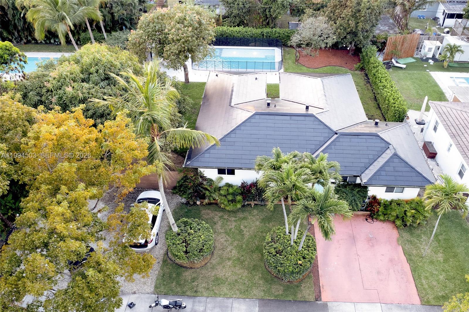 Step into luxury and effortless entertaining with this beautifully renovated home in Miami Shores. Modern sophistication defines every corner of this fully upgraded residence, featuring a brand-new renovated master bedroom and a new septic tank drainfield for long-term peace of mind.
A Tesla roof provides zero energy costs—even during hurricanes—thanks to its integrated backup system. Additional upgrades include impact windows, a full sprinkler system to keep your garden vibrant, and a 240V charger for electric vehicles.
Enjoy the expansive open-concept living and dining areas, then retreat to the grand master suite with blackout shades for ultimate privacy and comfort. The home also offers two guest bedrooms and a versatile extra room perfect for an office, gym, or studio.
Step outside to your private oasis: lush landscaped gardens, a pergola for shaded relaxation, a heated pool, and a six-person Jacuzzi. The oversized lot also provides plenty of room for your boat and RV.
Located just minutes from downtown Miami Shores, this home delivers luxury, comfort, and unmatched convenience.GOOD OPPORTUNITY FOR INVESTORS- HOUSE RENTED UNTIL END OF MAY/2027