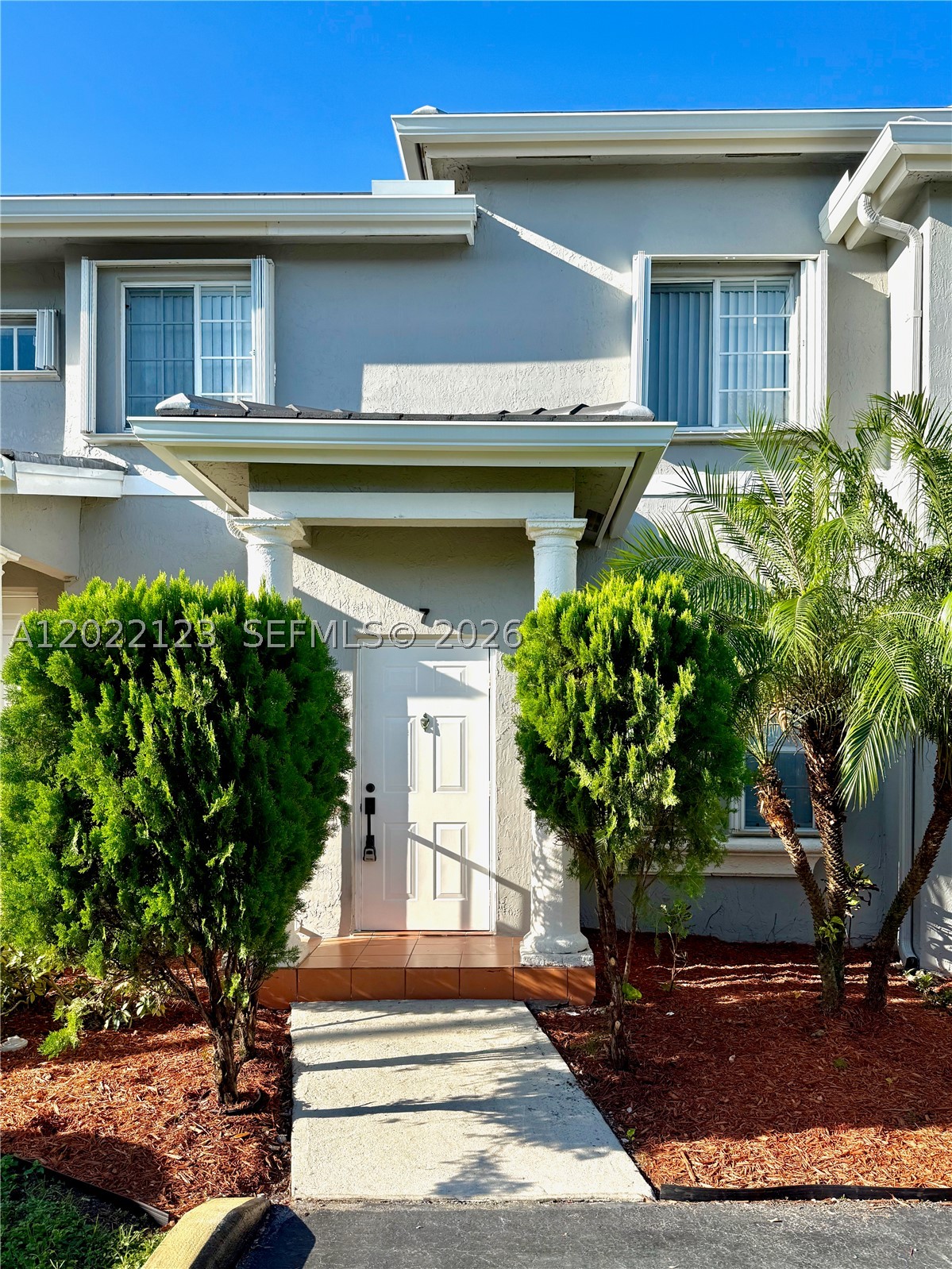 Centrally located in Doral, this bright 3-bedroom, 2.5-bathroom townhouse, with new 2025 ROOF is situated in a secure gated community with no rental restrictions, making it an excellent opportunity for both investors and end-users. Located within an A-rated school district & a pet-friendly neighborhood features accordion shutters throughout, a freshly painted interior, and luxury waterproof, scratchproof vinyl flooring. A modern kitchen offers white cabinetry, Calacatta quartz countertops, and brand-new stainless steel appliances, alongside a new washer and dryer. The primary suite includes a walk-in closet and a bathroom with a porcelain-tiled walk-in shower and Calacatta quartz. The second bathroom features a soaking tub with matching porcelain tile and quartz. Outside, the home includes a fenced, paved patio, two assigned parking spaces directly in front, plenty of guest parking, and access to the community pool.