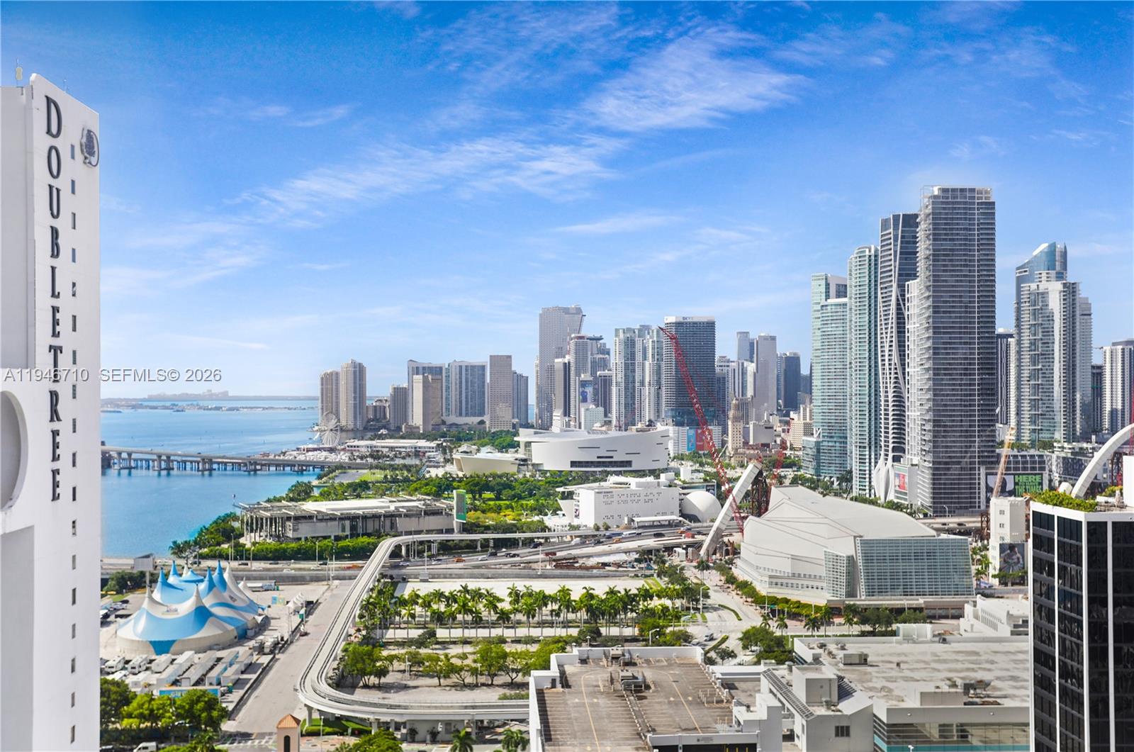 Experience elevated Miami living in this high-floor residence at 1750 N Bayshore Dr Unit 3210, offering stunning city and bay views. This well-maintained unit features an open layout with abundant natural light, spacious living areas, and a private balcony perfect for enjoying sunrise and sunset views. The kitchen flows seamlessly into the living space, ideal for entertaining or everyday living. Located in a full-service waterfront building with resort-style amenities including a pool, fitness center, 24-hour security, valet, and more. Prime location just minutes from Downtown Miami, Wynwood, Design District, and major highways. Ideal for end-users or investors seeking a centrally located Miami residence.