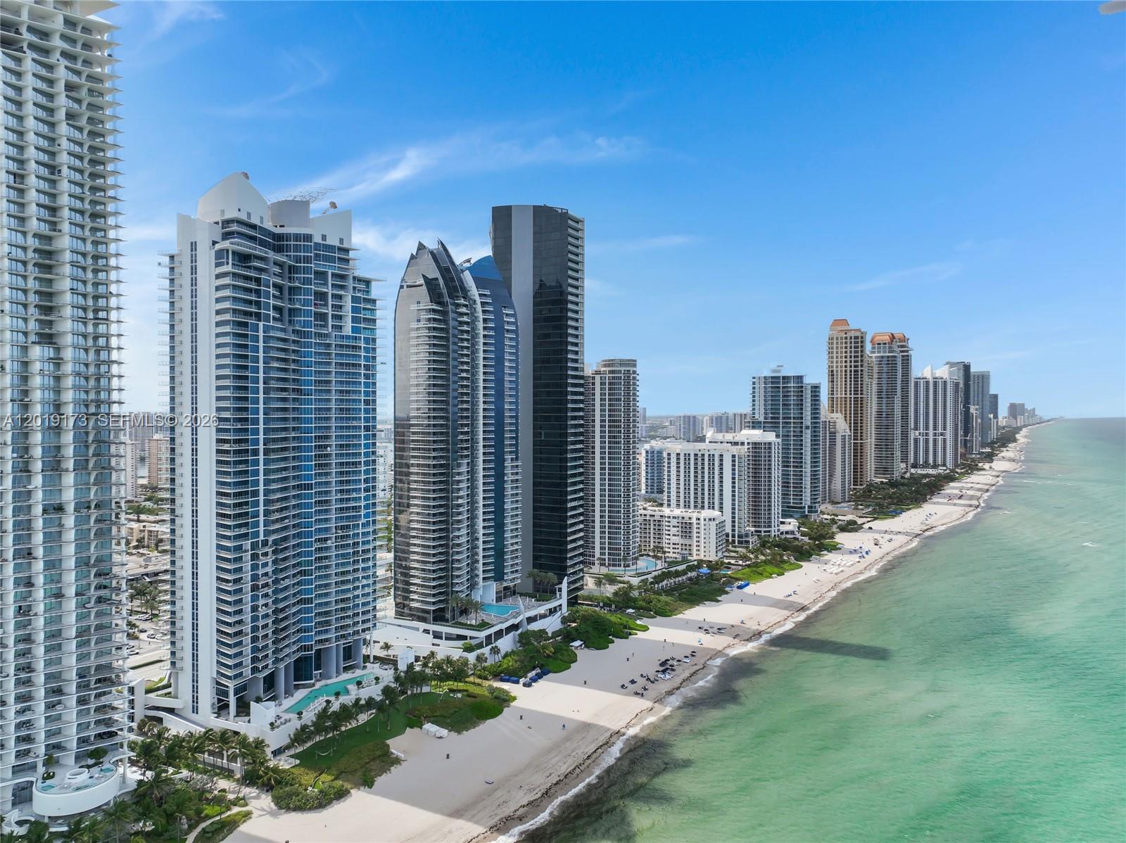 EXPERIENCE ELEVATED OCEANFRONT LIVING AT JADE BEACH Welcome to an exceptional residence in the prestigious Jade Beach, located in the heart of Sunny Isles Beach. Perched on the 28th floor, this spectacular flow-through residence showcases breathtaking panoramic ocean and city views, with expansive private balconies in every suite — perfectly designed to capture both stunning sunrises and unforgettable sunsets. This sophisticated residence features: 3 Luxurious Suites, 3.5 Elegant Bathrooms, Cream Marble Flooring in Main Living Areas, Elegant Wood Flooring in All Bedrooms, Custom Italian Wenge Doors, Electric Window Treatments, Spacious Walk-In Closets, Abundant Storage Space, Designer Furnishings Included — beautifully curated and fashionably decorated for a refined luxury lifestyle The expansive floor plan offers the perfect blend of elegance, comfort, and natural light in every room. World-Class Resort-Style Amenities Include:, Oceanfront Pool & Spa, Hot Tub, State-of-the-Art Fitness Center, Children’s Play Area, Valet Service, 24-Hour Concierge & Security Ideally located on prestigious Collins Avenue, just minutes from Bal Harbour Shops, Aventura Mall, fine dining, luxury boutiques, and international airports., Pet-Friendly Building A rare opportunity to own an extraordinary oceanfront residence in one of South Florida’s most exclusive destinations.