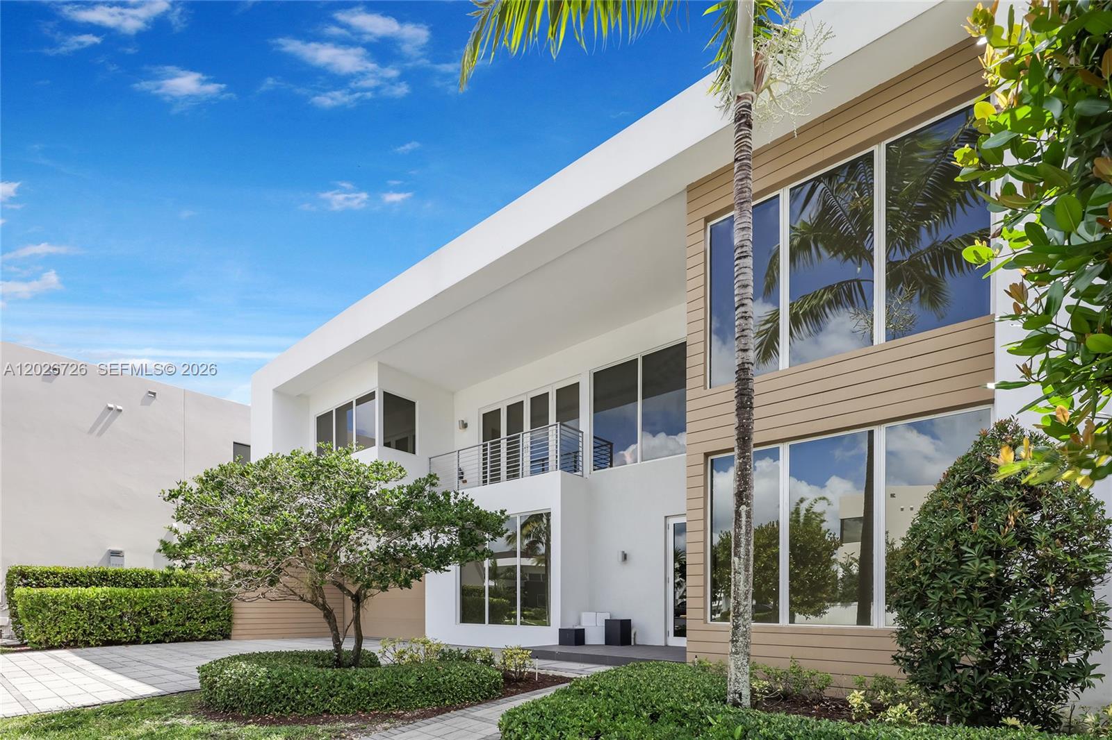 Welcome to 7441 NW 102 Ct, an exceptional residence in the prestigious Modern Doral 75 community. Ideally located directly across from the clubhouse, residents enjoy convenient access to the pool, fitness center, conference room, and plenty of additional guest parking.

This beautifully curated home offers 5 bedrooms, 5.5 bathrooms, 4,628 SF under A/C, and sits on an oversized 7,255 SF lot with an extra-long driveway accommodating approximately 8 vehicles in addition to the 2-car garage.
Featuring over $400,000 in upgrades and interior selections by designer Carla Colmenarez, the residence blends modern sophistication with warmth and comfort. Stunning 24x48 Nassau Sand marble flooring extends throughout the first and second floors, complemented by premium 7.5-inch engineered wood flooring in Dakota finish.

The chef’s kitchen features Carrara quartz countertops, 96 cm custom white cabinetry, white marble mini subway backsplash with steel accents, and top-of-the-line Viking appliances, including a gas cooktop, wine cooler, all with very minimal use.

Additional highlights include integrated sound throughout, Crestron smart home technology, recessed lighting, smart thermostats, and interior/exterior security systems.

The spacious backyard offers a pergola and barbecue area ideal for entertaining and family gatherings. Recently painted in 2025, this property has only been occupied occasionally by its owners a few times per year and remains in exceptional condition.