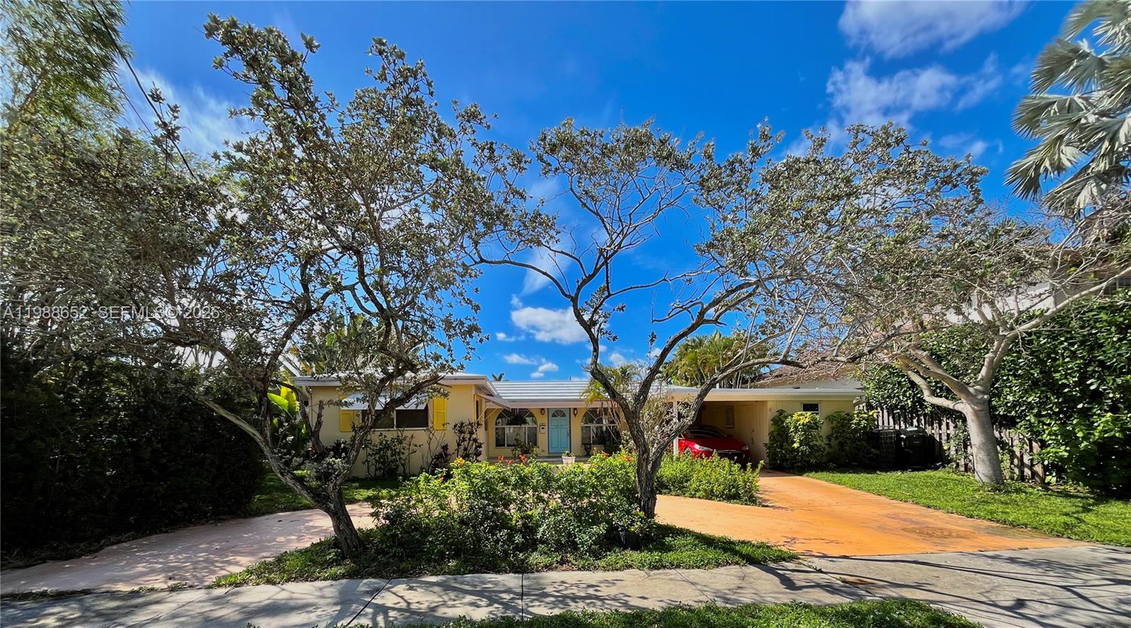 FLORIDA RIVERFRONT GEM on Mandarin Isle only minutes from downtown w/direct access to the ocean & no fixed bridges. Circular drive with tree island, carport and shed on a one entrance Isle.. Larger street frontage of 90 feet. Established gardens of flowers, orchids and fruit on all sides of this expanded home with rare Palladian windows. Home was deepened w/ the expansion of all rooms facing the river and a step down to the third BR or den. Living room is expanded with family-room, dining area and open to kitchen. Sliding glass doors in all rooms facing the river & huge amounts of natural light w/ large windows in all exterior rooms. Plenty of boat storage and full property width dock on the wide Bluefish Canal. Citrus Isles have been rapidly increasing in value. NO HOA.
