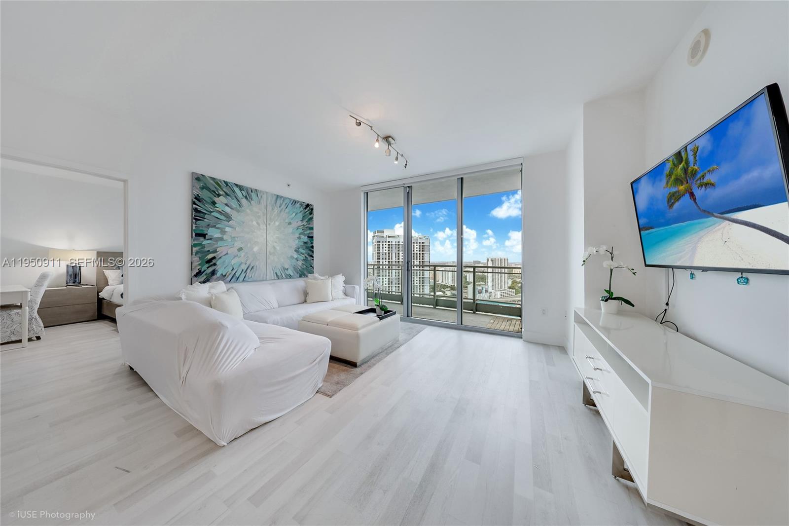 Welcome to the most Stunning renovated residence at the Ivy! This sophisticated 2-bed 2-Bath, 1,079 SQFT home features floor-to-ceiling impact windows and spacious balcony that framed panoramic Miami river and Skyline views. Split floor plan. Open kitchen concept offers stainless steel appliances. Spa-like baths, custom closets and window shades. Upgraded home with new flooring, new washer & dryer. Wake up to stunning views from both bedrooms. Enjoy a riverfront gated community and  resort-Style amenities including: infinity-edge pools, fitness center, spa, BBQ, outdoor playground, game room, and more. Steps from Brickell City Centre, expressways, metro mover, shops and restaurants! Perfect for those who want a home lifestyle built around walkability and World -class-cuisine!