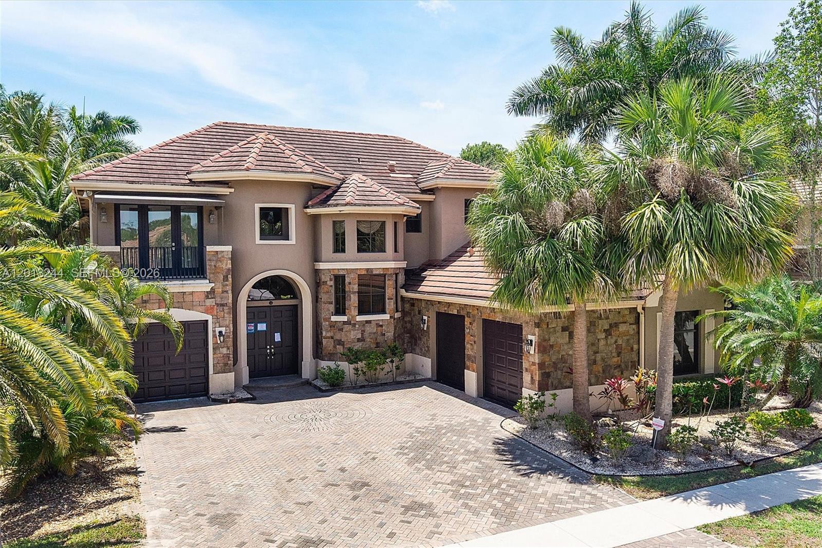 Offering 4,407 SF of thoughtfully designed living space, this 5 bedroom, 6 bath home in the Versailles neighborhood of Wellington blends spacious comfort with refined style. The expansive layout features generous living and entertaining areas, while each bedroom is paired with a well-appointed bath for added convenience. Step outside to enjoy multiple outdoor living spaces, including a balcony, porch, and patio, all overlooking a private, fenced backyard. Complete with a pool and spa, this outdoor retreat is perfect for relaxing or hosting guests, delivering the best of Florida living both inside and out. HOA $558.40/month with association amenities such as a community pool, clubhouse, fitness center, tennis courts, and much more! Property sold "As-is". Buyer and/or buyer's agent responsible for verifying all pertinent information deemed relevant by the prospective buyer, including but not limited to square footage, acreage, utilities, taxes, zoning, permitting, condition, school zones, HOAs, etc. Seller requires use of their contract, their title company, and a minimum of 5% earnest money.