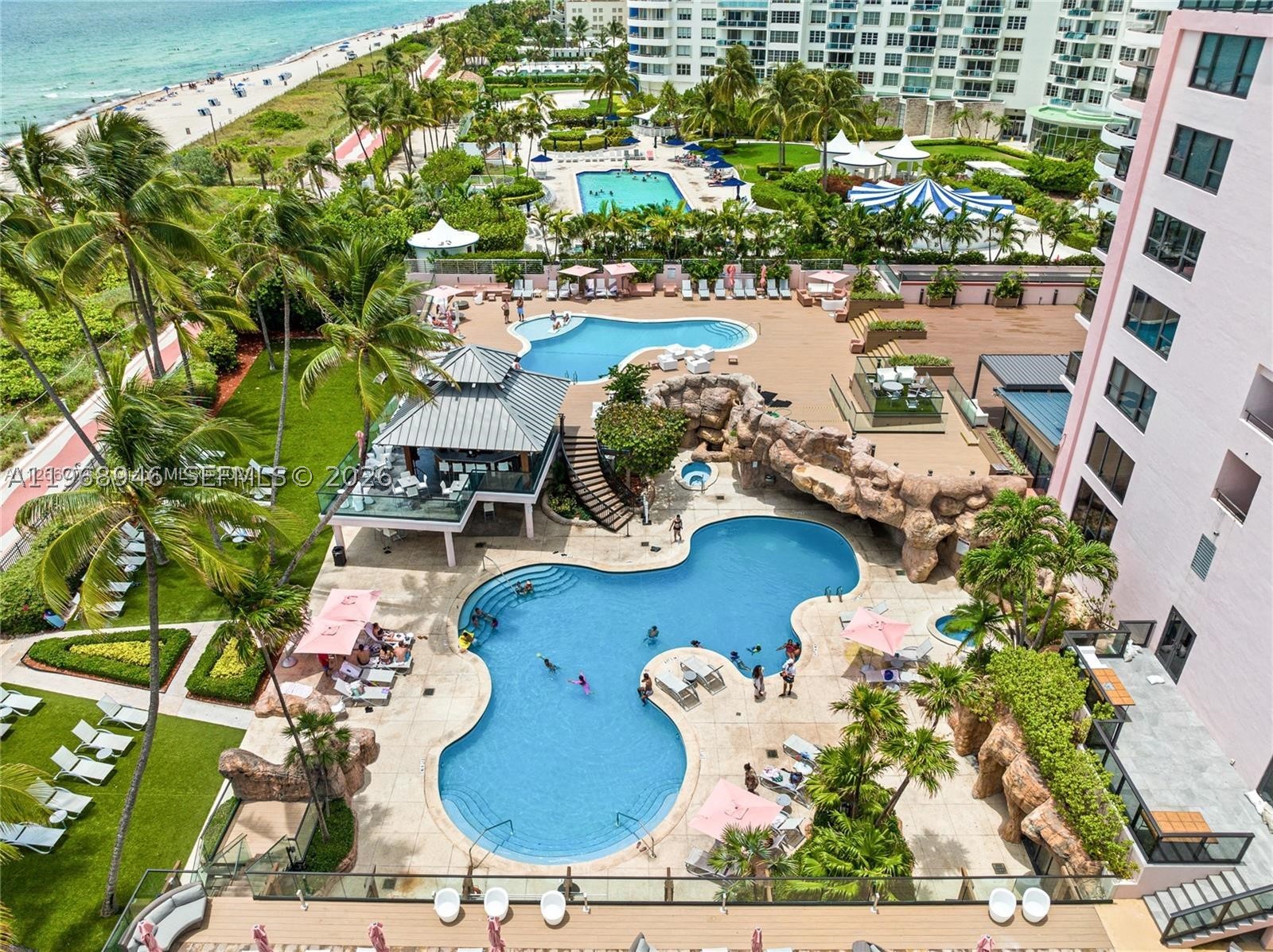 On the ocean, The Alexander offers a multitude of amenities such as valet parking, concierge, attended front desk staff, security, two heated swimming pools, hot tubs, gym, steam room, sauna, poolside full liquor bar and food service, full service hair salon, boat rental and boat dock rental at marina, access to the beach, water sports available (jet skis, canoes, kayaks), oceanside boardwalk, bicycles, complimentary for owners beach service (chair lounge and umbrella), poolside cabanas.  Rental program available to owners who wish to to rent out their units when not using them.  Electricity, air conditioning, cable tv, wifi, internet included in maintenance fee.  Completely remodeled and upgraded condo tastefully done with closet cabinetry,  newer a/c units, impact windows and door, open balcony with ocean view and Indian Creek view.  Daily rentals and short term rentals allowed.