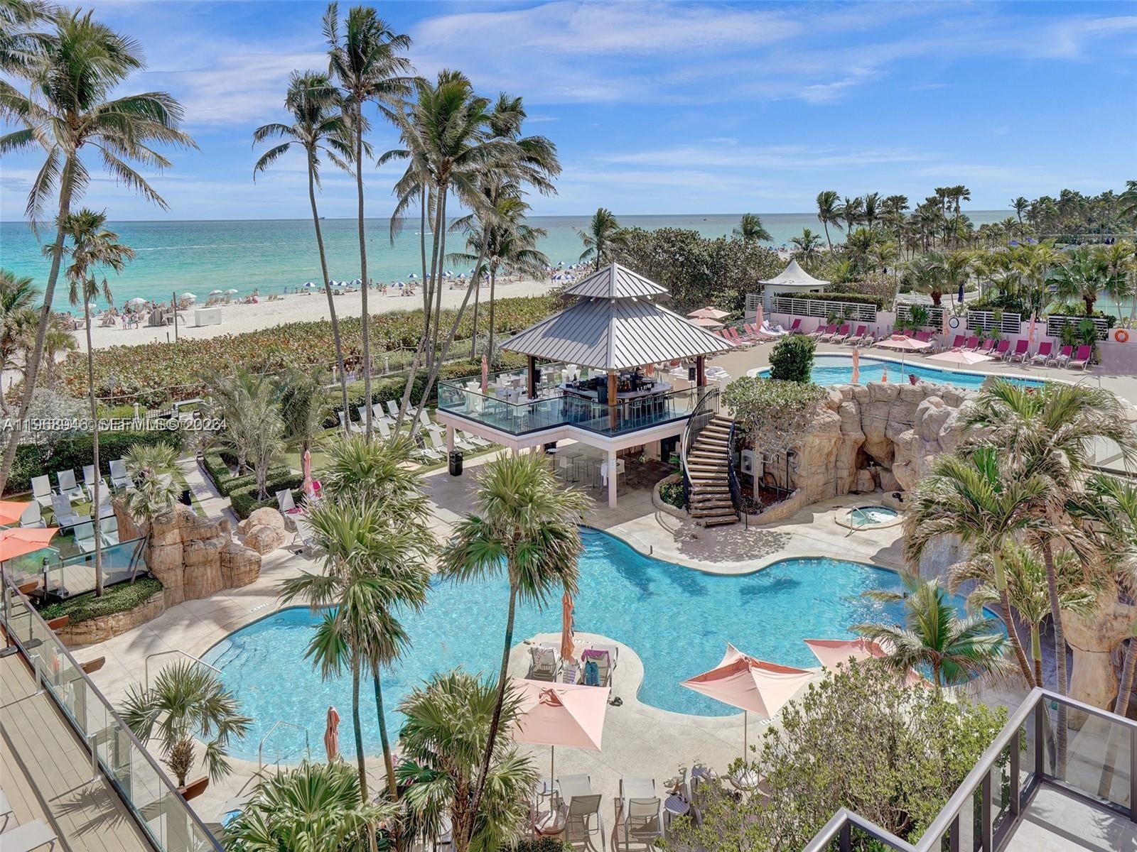On the ocean, The Alexander offers a multitude of amenities such as valet parking, concierge, attended front desk staff, security, two heated swimming pools, hot tubs, gym, steam room, sauna, poolside full liquor bar and food service, full service hair salon, boat rental and boat dock rental at marina, access to the beach, water sports available (jet skis, canoes, kayaks), oceanside boardwalk, bicycles, complimentary for owners beach service (chair lounge and umbrella), poolside cabanas.  Rental program available to owners who wish to to rent out their units when not using them.  Electricity, air conditioning, cable tv, wifi, internet included in maintenance fee.  Completely remodeled and upgraded condo tastefully done with closet cabinetry,  newer a/c units, impact windows and door, open balcony with ocean view and Indian Creek view.  Daily rentals and short term rentals allowed.