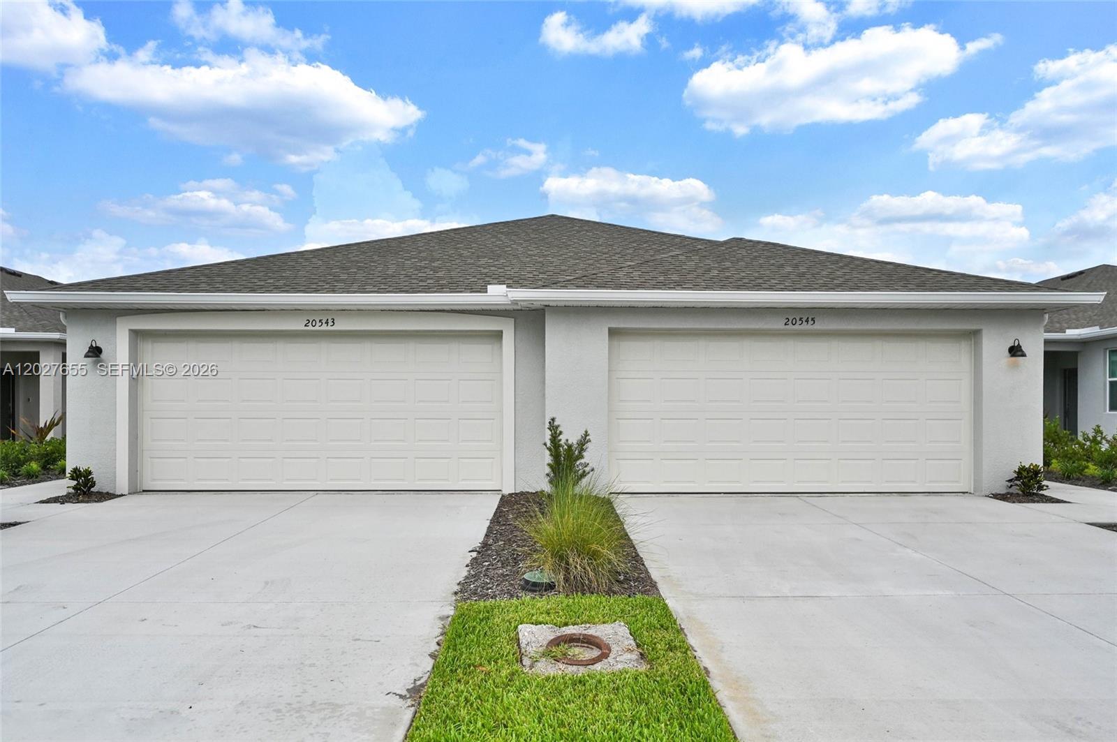 Welcome to Ibis Landing, a beautiful, fully gated golf community in Lehigh Acres, Florida, just two hours from Miami yet feeling miles away from the busy city life, and only 10 minutes from all the main attractions of Fort Myers. This wonderful home features a double-car garage and a private driveway that can accommodate up to four cars. Brand new and never lived in, the home offers three bedrooms and two full bathrooms, with all light fixtures and blinds already installed. Enjoy one of the most stunning clubhouses in the area, complete with a resort-style pool, sauna, bar, and restaurant for the ultimate golf community lifestyle. The community provides gated entrances, street lighting, and security guard patrols. Just minutes from major highways, restaurants, and supermarkets in the Fort Myers area, this is a place you'll love to call home.