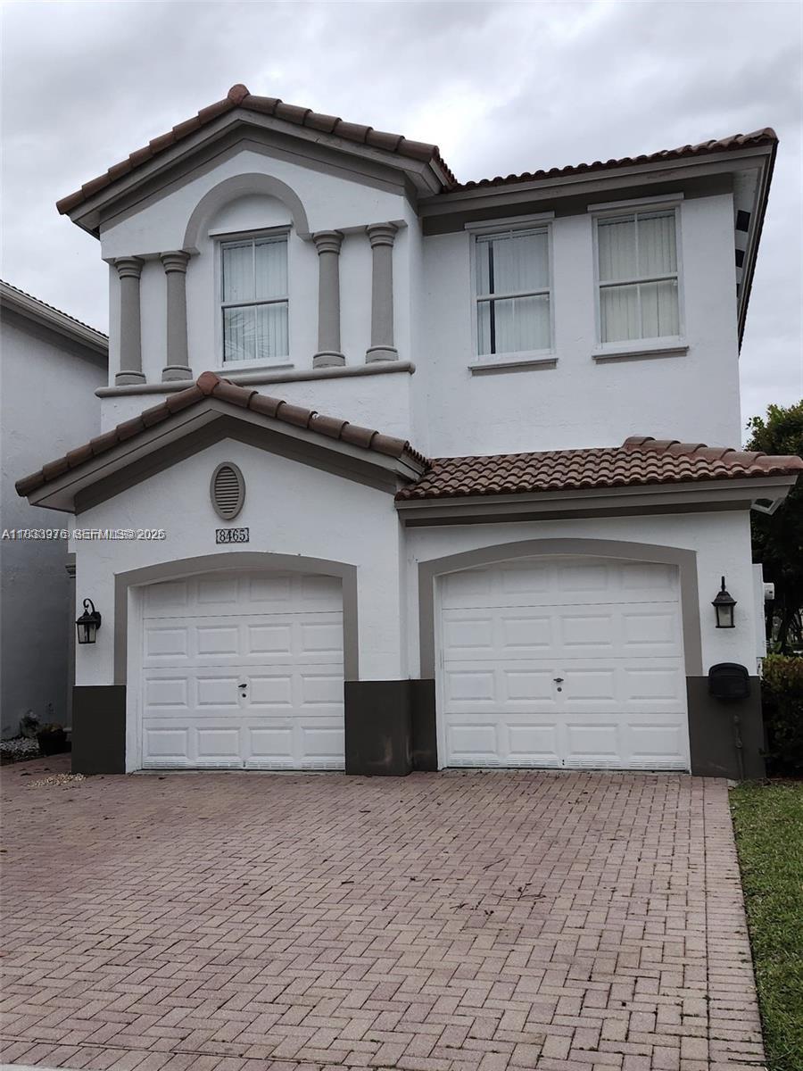 Amazing property in mediterranean at islands at doral with this freshly painted, SPECTACULAR PORCELAIN Floors,  completly remodeled and corner "coach" many items to mention, 3 bedroom 2 and 1/2 bathrooms. Spacious living room, family room and separate dining room. Nice patio for BBQ, double car garage and community pool across the street. ITS LOCATION is perfect .. Unit is vacant and on LB COMBO