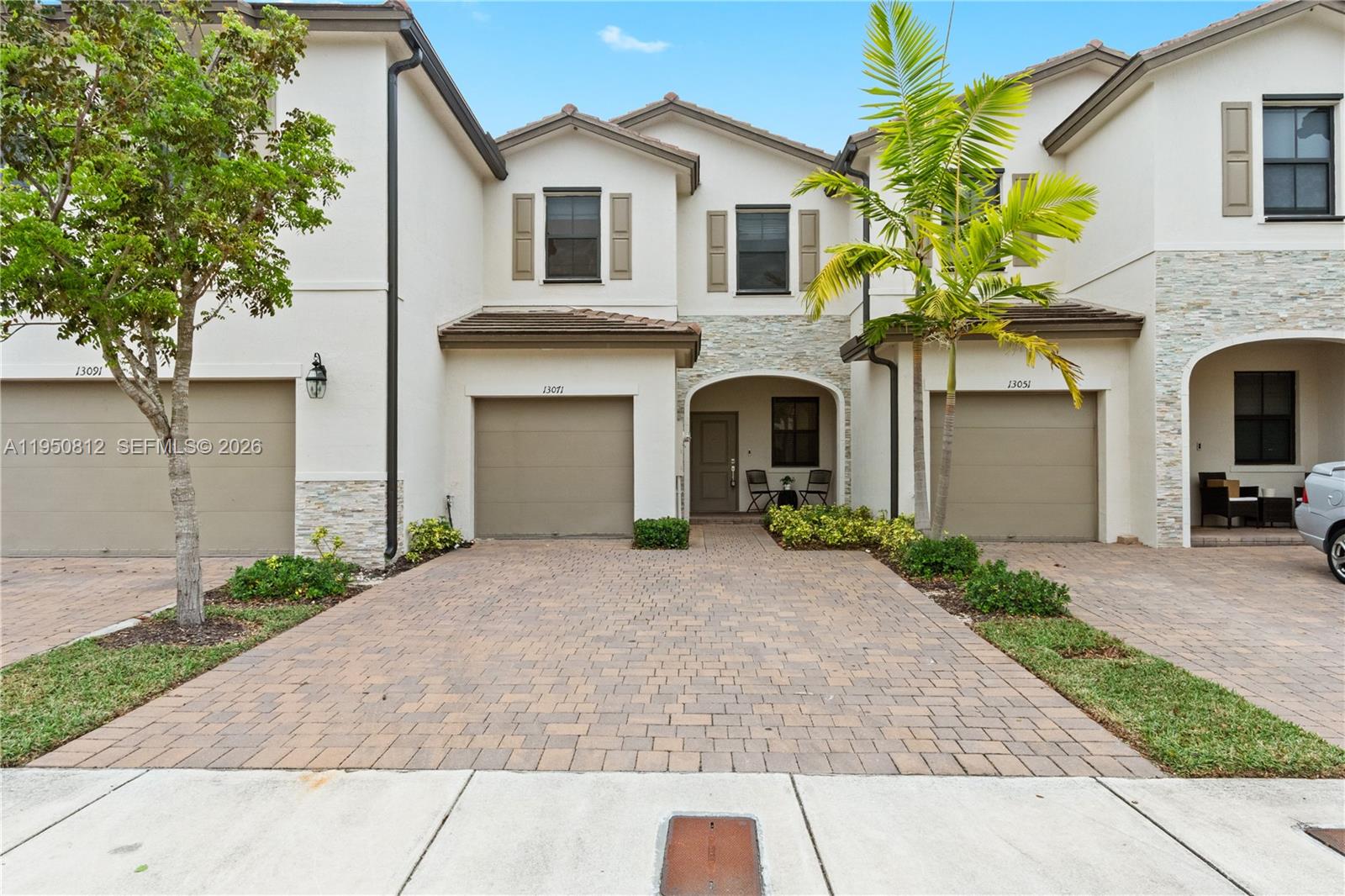 Welcome to 13071 SW 232nd Ln, a brand new townhome in the guard gated community of Sienna Reserve. This new construction residence offers 3 bedrooms and 2.5 bathrooms with a clean, neutral color palette and crisp white cabinetry throughout. The home also features a spacious backyard, perfect for outdoor entertaining or relaxing. Ideally located just steps from the clubhouse, residents enjoy access to a club room, gym, resort style pool, kids playground, and scenic walking paths. Conveniently situated near major roadways, shopping, dining, and schools, this home blends modern comfort, security, and lifestyle amenities in one of the area’s most desirable new communities
