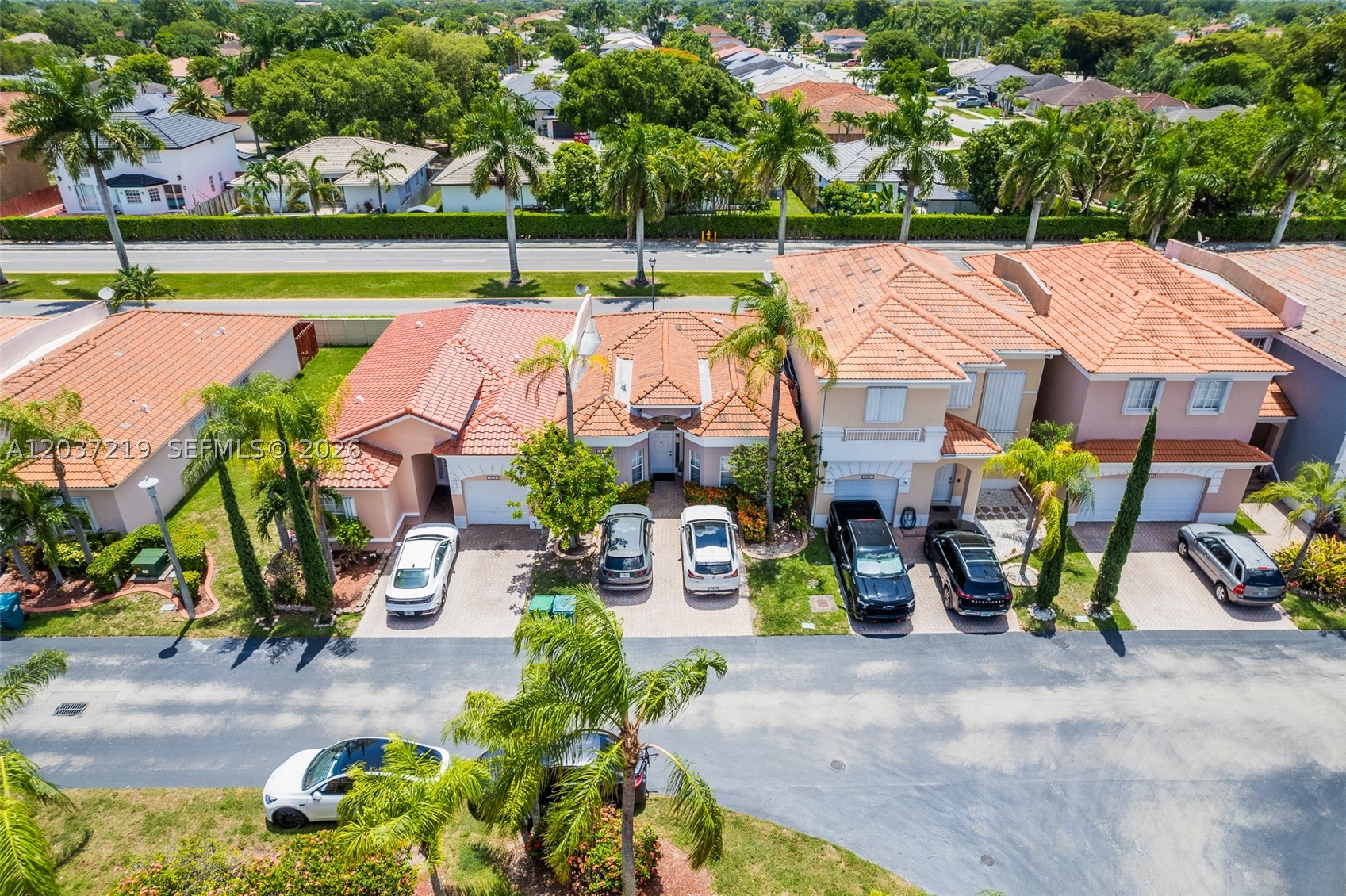 Welcome to this beautifully maintained, move-in-ready 3-bedroom, 2-bathroom home in a desirable South Florida community. Featuring charming curb appeal with lush landscaping, mature palm trees, and a welcoming paved driveway, this property offers comfort, style, and functionality.
Step inside to discover a bright, open-concept living space with high ceilings, sleek tile flooring throughout, and an abundance of natural light. The spacious living room flows seamlessly into the dining area, perfect for entertaining. The gourmet kitchen boasts white cabinetry, stainless steel appliances, generous counter space, and a convenient breakfast bar.
This home features three generously sized bedrooms with ample closet space. The primary suite offers a peaceful retreat, while the additional two bedrooms are ideal for family, guests, or a home office. Both bathrooms are modern and updated with elegant wood vanities, quartz countertops, designer lighting, and large LED mirrors.
Enjoy Florida living at its best on the expansive tiled patio with a large red umbrella, comfortable outdoor seating, and a fully fenced backyard — perfect for relaxing, dining al fresco, or family gatherings. Additional highlights include a two-car garage, inside laundry with full-size washer and dryer, and plenty of storage throughout.
Located near shopping, dining, parks, and major roadways, this home combines convenience with resort-style living. Don’t miss this rare opportunity!