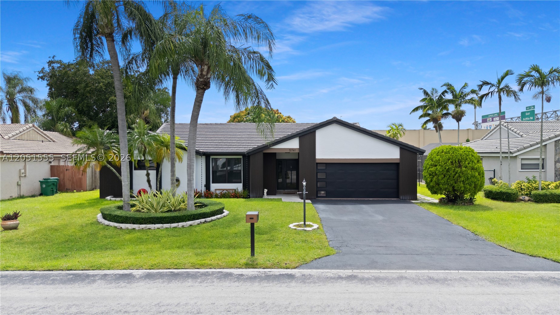 Welcome to Ivanhoe Waterford, one of West Davie’s most desirable communities! Nestled on a quiet street toward the back of the neighborhood, this beautifully maintained one-story ranch offers a desirable split-bedroom floor plan with 3 bedrooms, 2 updated bathrooms and a 2-car garage. Inside, you’ll find tile flooring throughout, vaulted ceiling, and spacious formal living, family, and dining rooms designed for both everyday living and entertaining.
The updated kitchen features granite countertops and a matching granite backsplash, stainless steel appliances, and a breakfast bar that overlooks the inviting family room, creating the perfect gathering space. Step outside and enjoy Florida living from the covered, screened patio overlooking a private backyard. The outdoor space also features a mature mango tree, offering both shade and delicious seasonal fruit. Enjoy peace of mind with major upgrades already completed, including a newer tile roof and gutter system (2023), all impact-rated windows and sliding glass doors, and a custom impact-rated garage door. The exterior was freshly painted in 2025 and enhanced with an updated front facade, providing outstanding curb appeal. With an incredibly low HOA fee of just $350 per year, this home offers exceptional value. Ideally located with convenient access to I-75 and I-595 and zoned for A-rated public schools, this is an outstanding opportunity to enjoy the best of West Davie living.
