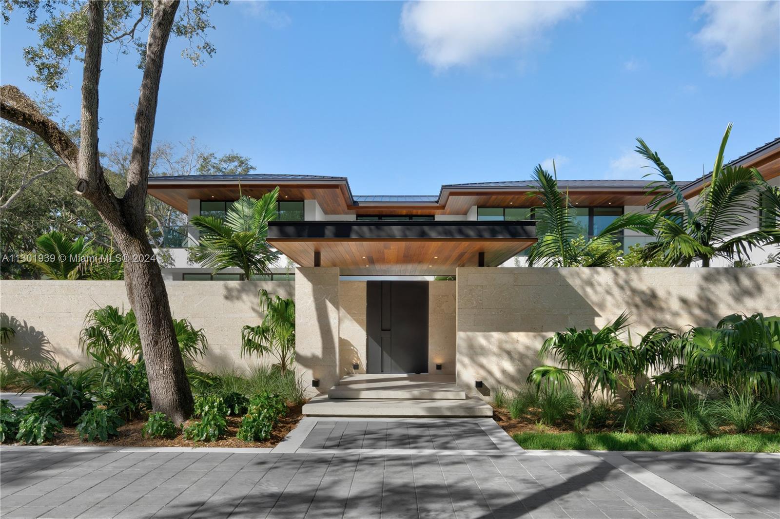 CO has been issued and house is Move-In-Ready! Welcome to the Balli Group's latest signature residence. Located in the coveted gated community of Snapper Creek Lakes with a community marina and direct access to Biscayne Bay. This resort-style estate spans over 10,500+SF of the +/- 50,000SF lot—mature oak trees and lush landscaping frame this meticulously curated Tropical Modern Residence. Designed by the renowned Architect and Interior Design Team, Giorgio and Adi Balli, the residence provides a thoughtfully designed floorplan with expansive entertainment and living spaces. While walking through the residence, one can expect to experience a variety of textures, materials, tones, and sounds that have all been purposely blended to create a harmonious balance with the luscious grounds.