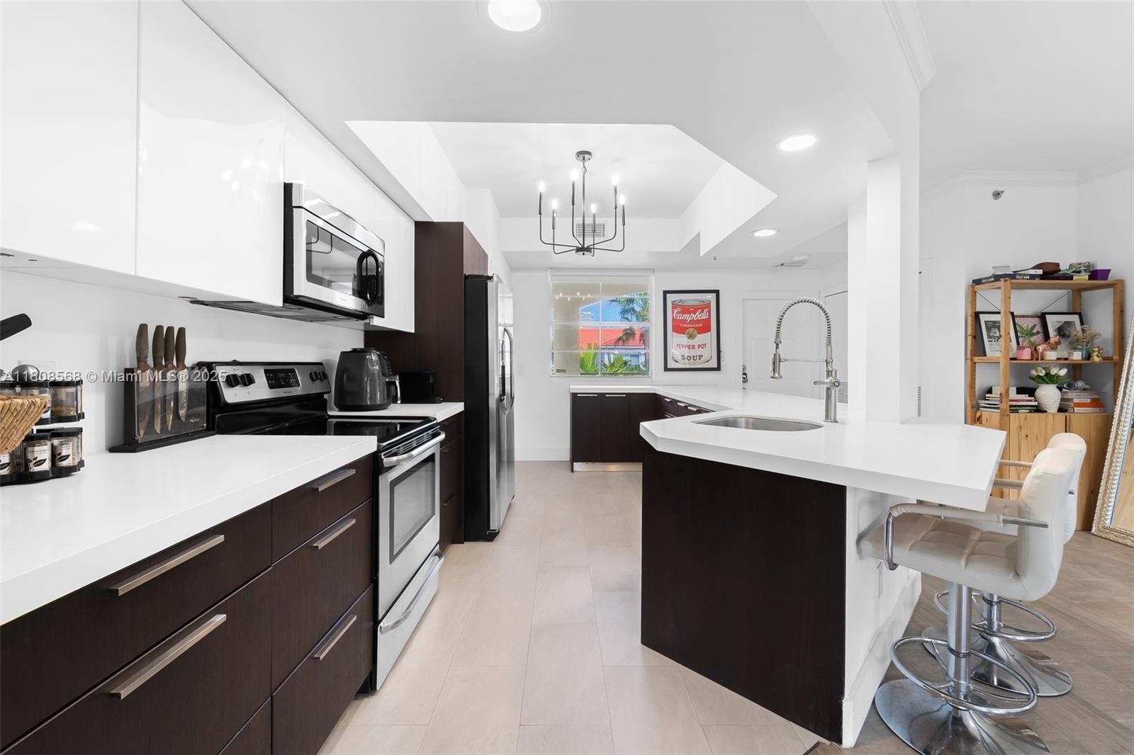 Enjoy stylish waterfront living in this fully upgraded 2-bedroom, 2-bath residence with stunning views throughout the community. The spacious primary suite offers a large walk-in closet, while the oversized second bedroom provides added flexibility.

The renovated kitchen features sleek cabinetry, stainless steel appliances, and modern flooring throughout. Two private balconies—one off the primary suite and one off the living room—invite seamless indoor-outdoor living.

Resort-style amenities include two heated pools, a fitness center, Pilates/Yoga studio, clubhouse, lighted tennis courts, and a BBQ pavilion. Pet-friendly and investor-friendly with rentals allowed up to 12 times per year.
Walk to Publix, dining, shopping, parks, and top-rated A+ schools—waterfront living at its best.