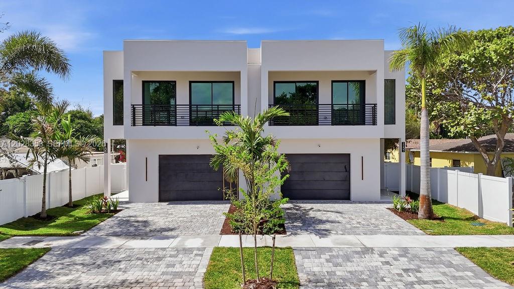 1135 & 1137 NE 11th Ave, Fort Lauderdale, FL – Lake Ridge    New construction residence offering 4 bedrooms and 3.5 bathrooms in the desirable Lake Ridge neighborhood. Modern open-concept floor plan with floor-to-ceiling windows providing abundant natural light throughout.    Contemporary glass kitchen design in white and light wood finishes, featuring panel-ready JennAir appliances and a spacious island overlooking the main living areas. Built-out closets provide functional storage solutions throughout the home.    Primary suite includes a spa-style bathroom with oversized shower and custom closet build-outs. Dedicated laundry room with utility sink.    Interior features include integrated ceiling speakers throughout the home and pre-wired security camera system.    Private backyard with outdoor BBQ area and a 2-car garage.    Modern design, quality finishes, and exceptional natural light.