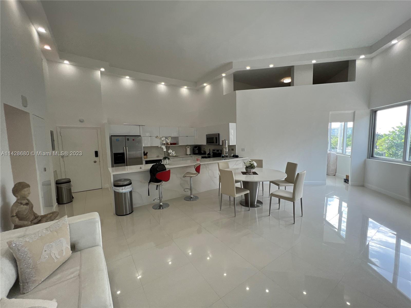Burleigh House offers a unique opportunity for tenants to immerse themselves in a stylish, modern residence, perfectly positioned on the famed Collins Avenue. Freshly renovated in 2023, this home resonates with contemporary design, spacious interiors, and state-of-the-art features. The raised ceilings and open-concept kitchen create an ambiance of spaciousness, adding a whole new dimension to the apartment's already generous layout. A loft has been smartly incorporated into the unit, adding versatility to cater to your needs. Use it as a tranquil home office, a cozy reading nook-the choice is yours. The real showstopper, however, is the mesmerizing beach water view. Imagine waking up each day to the serene sight of the expansive ocean or winding down each evening to the sound of the waves.