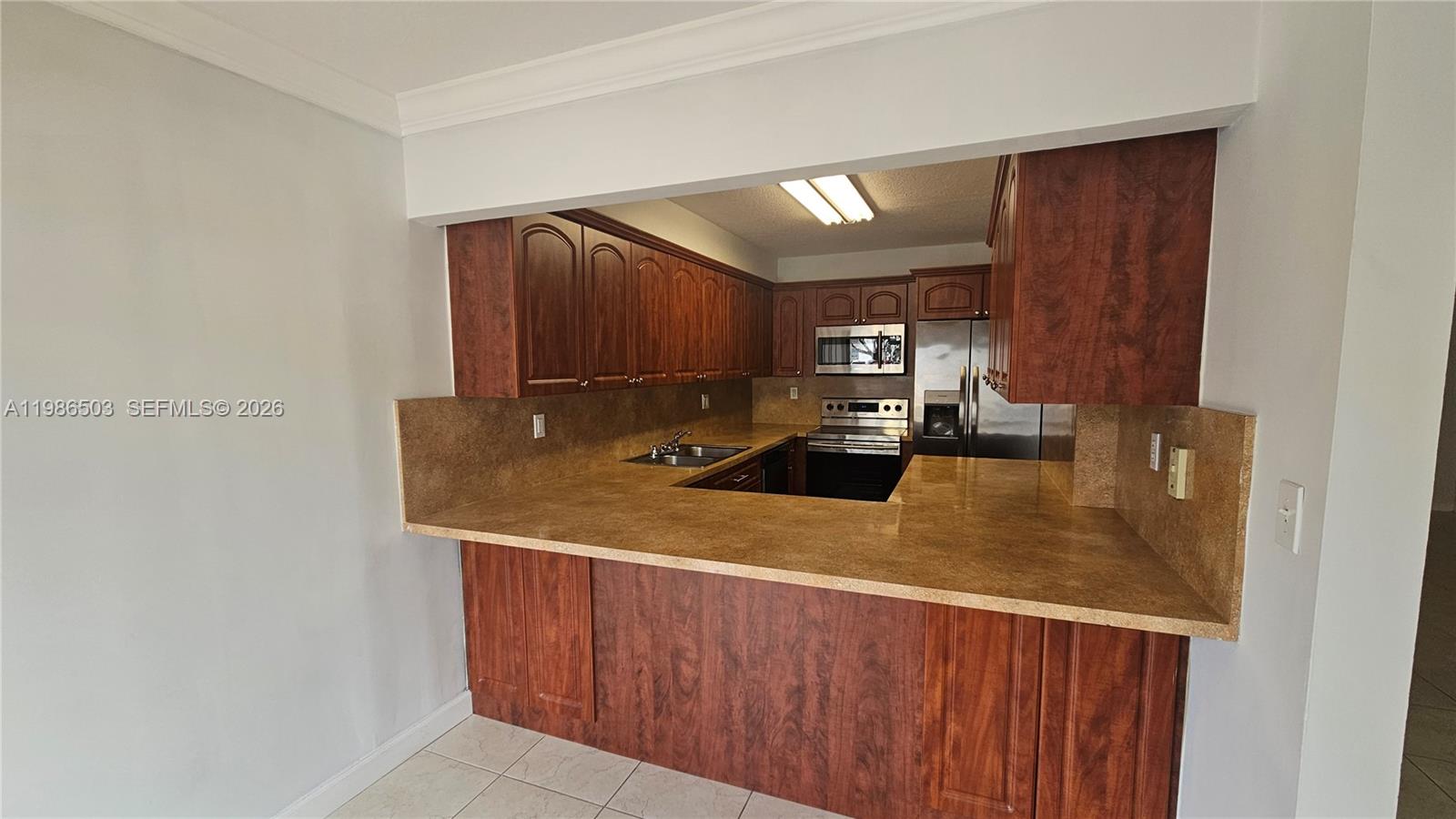 Back on the market with a fresh price reduction! Don’t miss this cash-only opportunity to own a well-located condo with excellent potential. Featuring a bright layout, functional design, and access to desirable community amenities, this unit is perfect for investors, downsizers, or anyone looking for a smart real estate opportunity.

First floor unit located in the private community of Miller Gardens. This is the split model with 2 bedrooms and 2 full bathrooms. Each bedroom has a walking closet; master bath has a big shower with 2 vanities; second bedroom has an extra wall closet for more storage. Kitchen fully equipped with stainless steel appliances. Washer & dryer. Rheem A/C. Freshly painted, new roller shades, crown moldings, hurricane shutters; 2 assigned parking spaces located near the entrance. Miller Gardens is a gated community with 24hrs guards for your safety. There is a monthly special assessment of $217.28