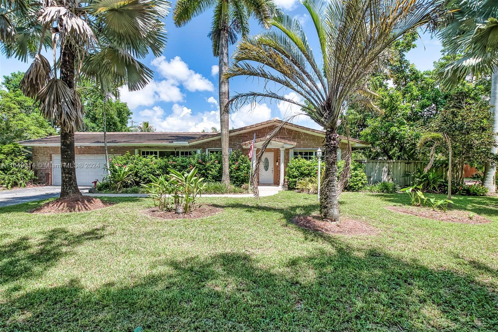 Great opportunity to remodel and make this 3 bedroom/ 2 bath Palmetto Bay gem your own. Formal living and dining rooms. Large eat-in kitchen. Partial accordion and panel shutters. Fenced backyard with mature trees, screened porch, fire pit, shed and sprawling lawn with plenty of space to park a boat. 2 car garage with workshop area and storage cabinetry.