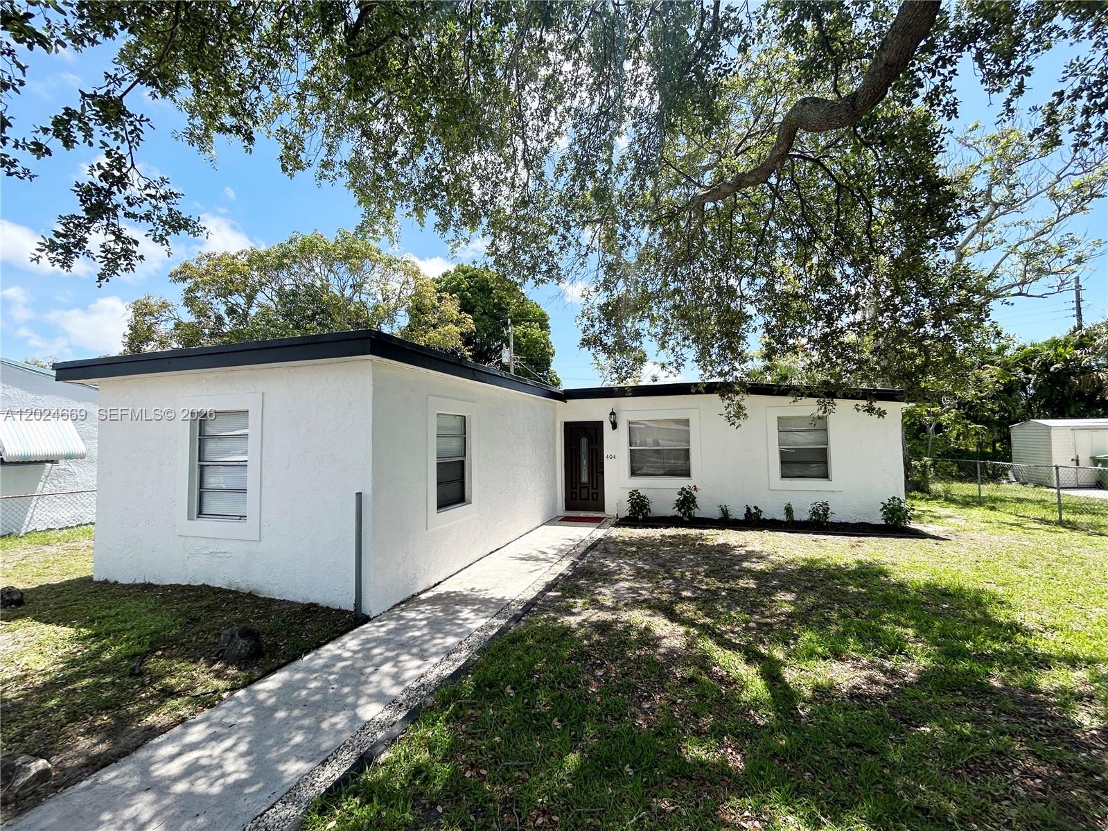 Beautifully renovated 3-bedroom, 1.5-bath smart home conveniently located near Downtown Fort Lauderdale. This move-in ready property features a completely updated interior with new flooring throughout, a modern kitchen with updated appliances, and renovated bathrooms. Enjoy a spacious front lawn with plenty of outdoor potential, plus a shed for additional storage. Conveniently located near shopping, dining, entertainment, and major highways. A great opportunity to enjoy comfort, style, and smart home living in a central location.